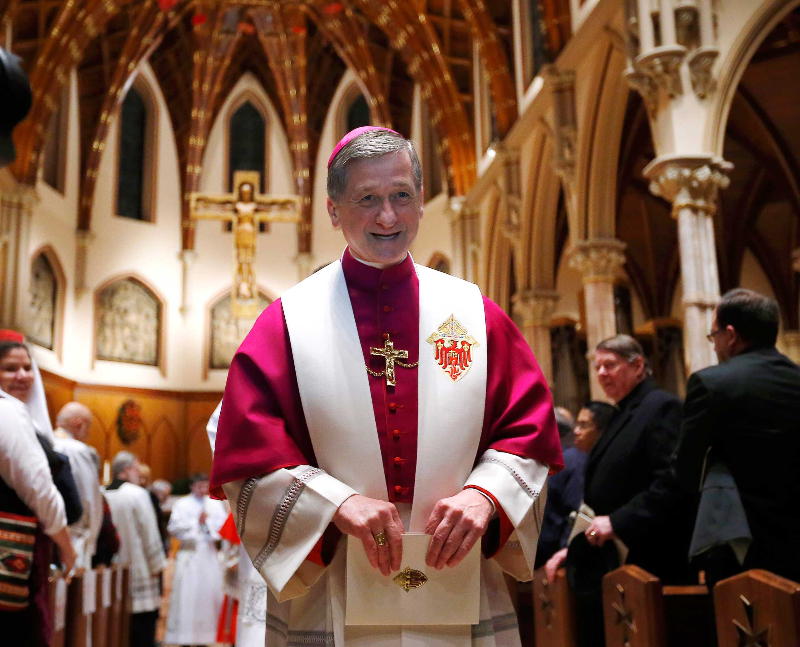 Bishop Blase Cupich, Pope Francis' first major appointment in the hierarchy of the U.S. Catholic Church, leaves Holy Name Cathedral as part of a ritual a day ahead of his installation as the new archbishop in Chicago, Nov. 17, 2014. (Jeff Haynes—Reuters)