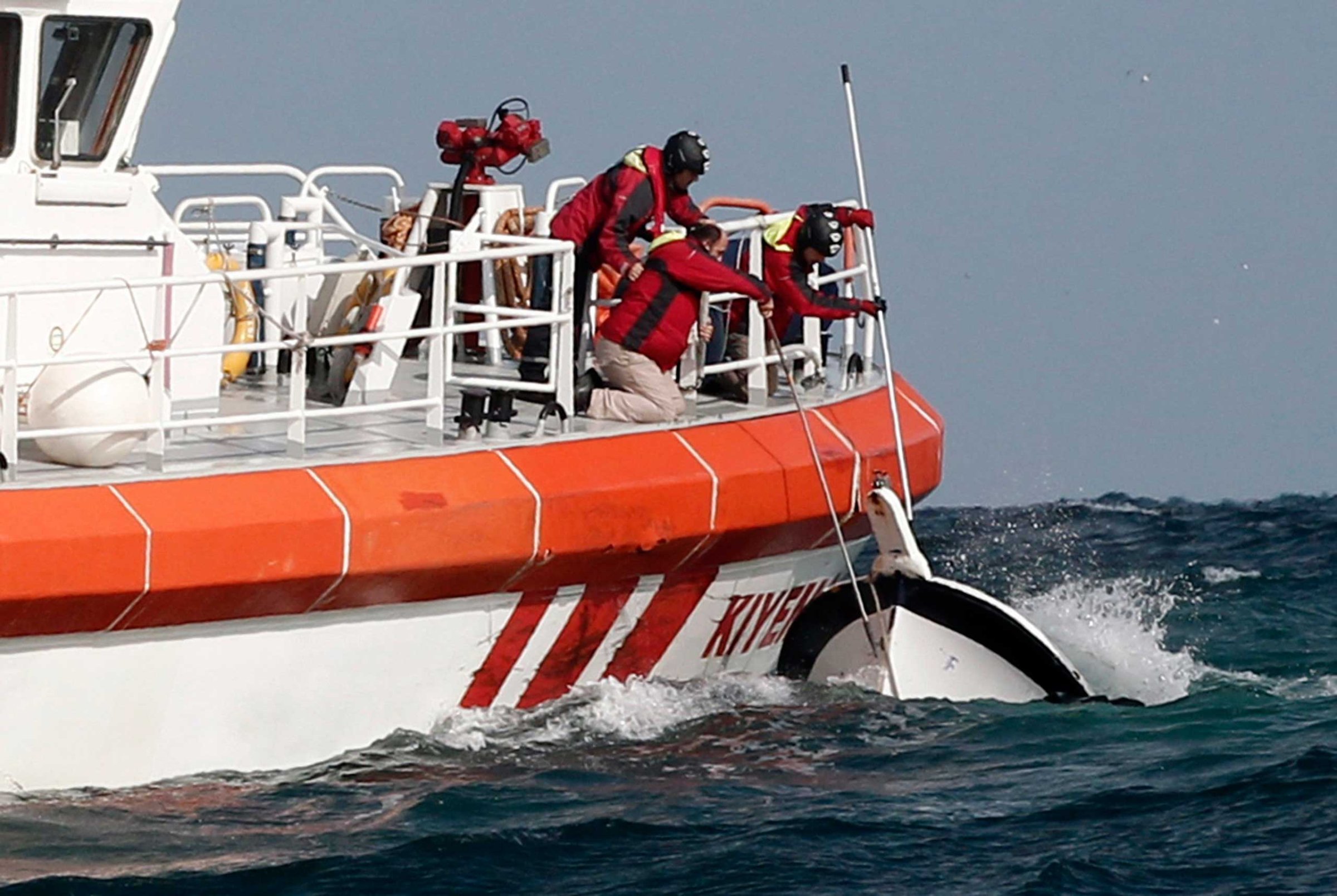 Rescuers retrieve a boat that sank, killing 24 migrants, off the Black Sea village of Garipce near Istanbul on Nov. 3, 2014.