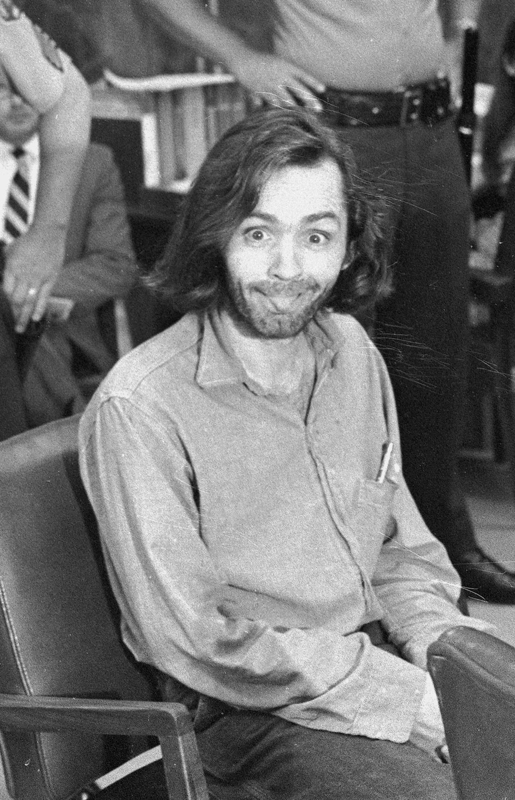 Manson sticks his tongue out at photographers as he appears in a Santa Monica, Calif., courtroom on June 25, 1970.
