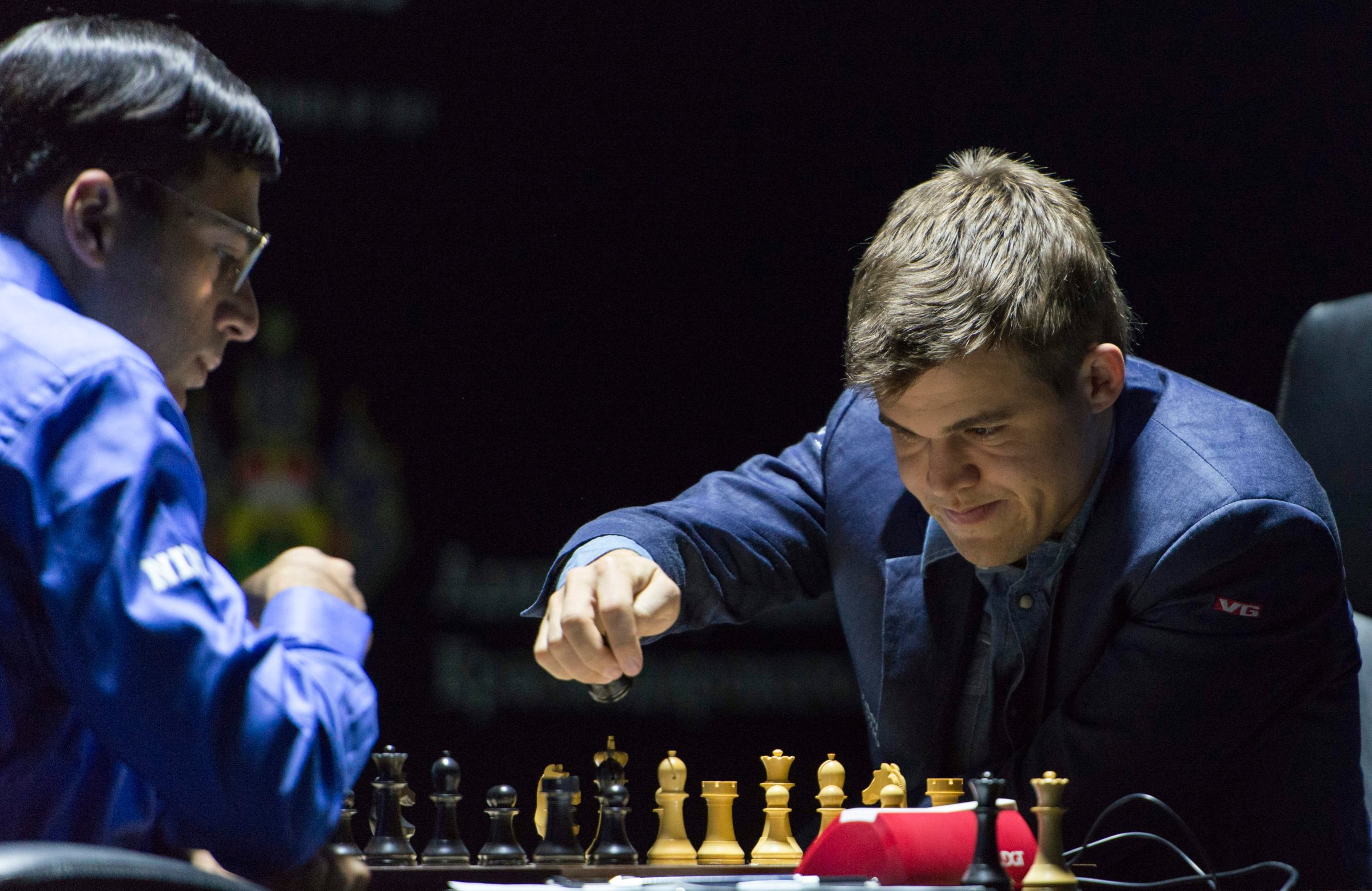 Norway's Magnus Carlsen, currently the top ranked chess player in the world makes a move as he plays against India's former World Champion Vishwanathan Anand at the FIDE World Chess Championship Match in Sochi, Russia on Nov. 9, 2014.