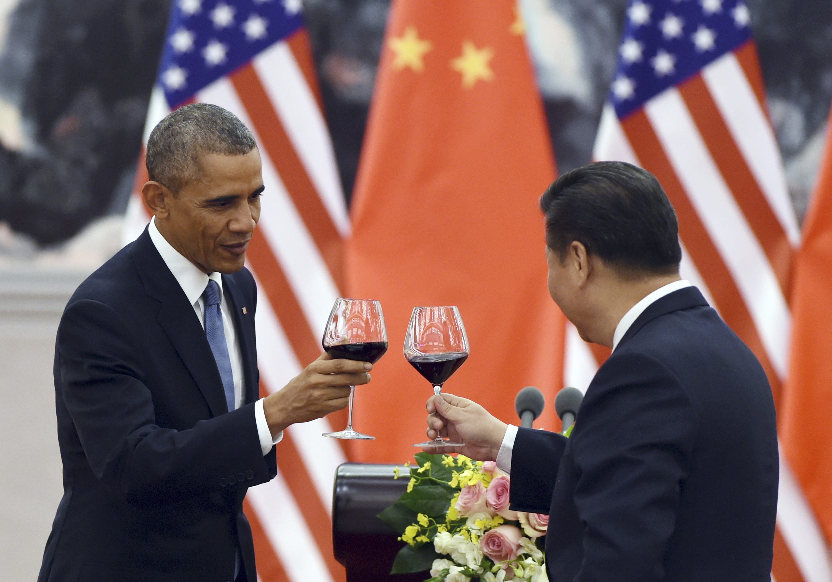 U.S. President Barack Obama, left, toasts with Chinese President Xi Jinping at a lunch banquet in the Great Hall of the People in Beijing on Nov. 12, 2014 (Greg Baker—AP)