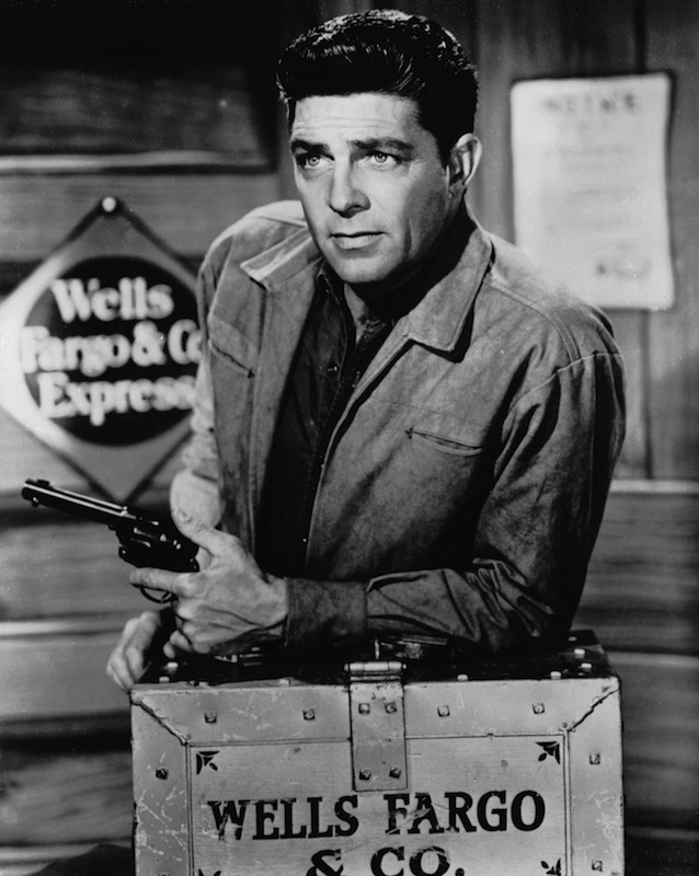 Dale Robertson on 'Tales of Wells Fargo' in 1960. As an actor, Robertson can hardly say heck with his hands tied, but he is probably the best horseman in television, and his shy. Sunday-go-to-meetin' smile provokes what an agent describes as 'the sexiest mail in Hollywood.' -TIME, Mar. 30, 1959