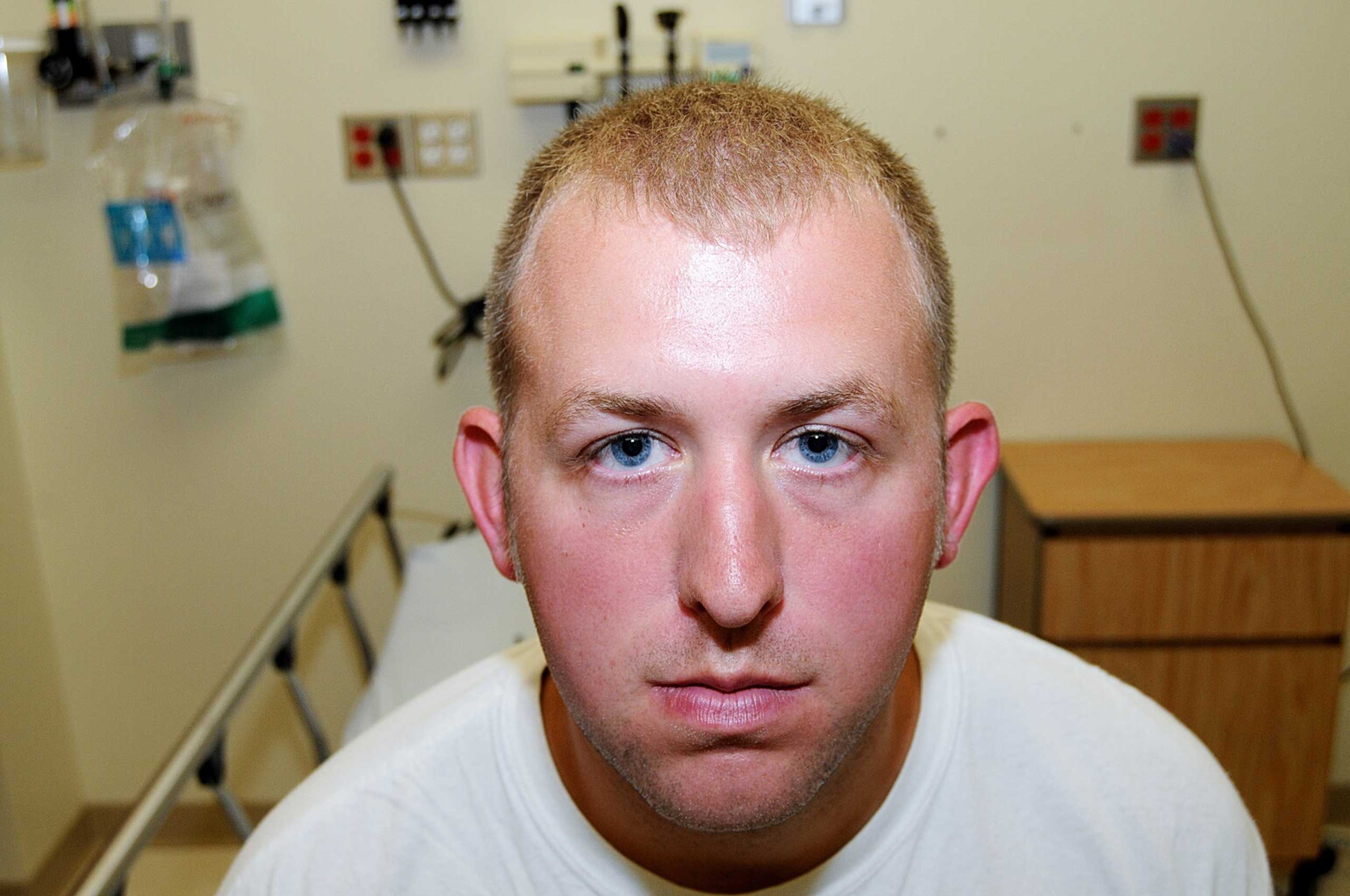 Ferguson police officer Darren Wilson is seen during his medical examination after the shooting of Michael Brown (St. Louis County)