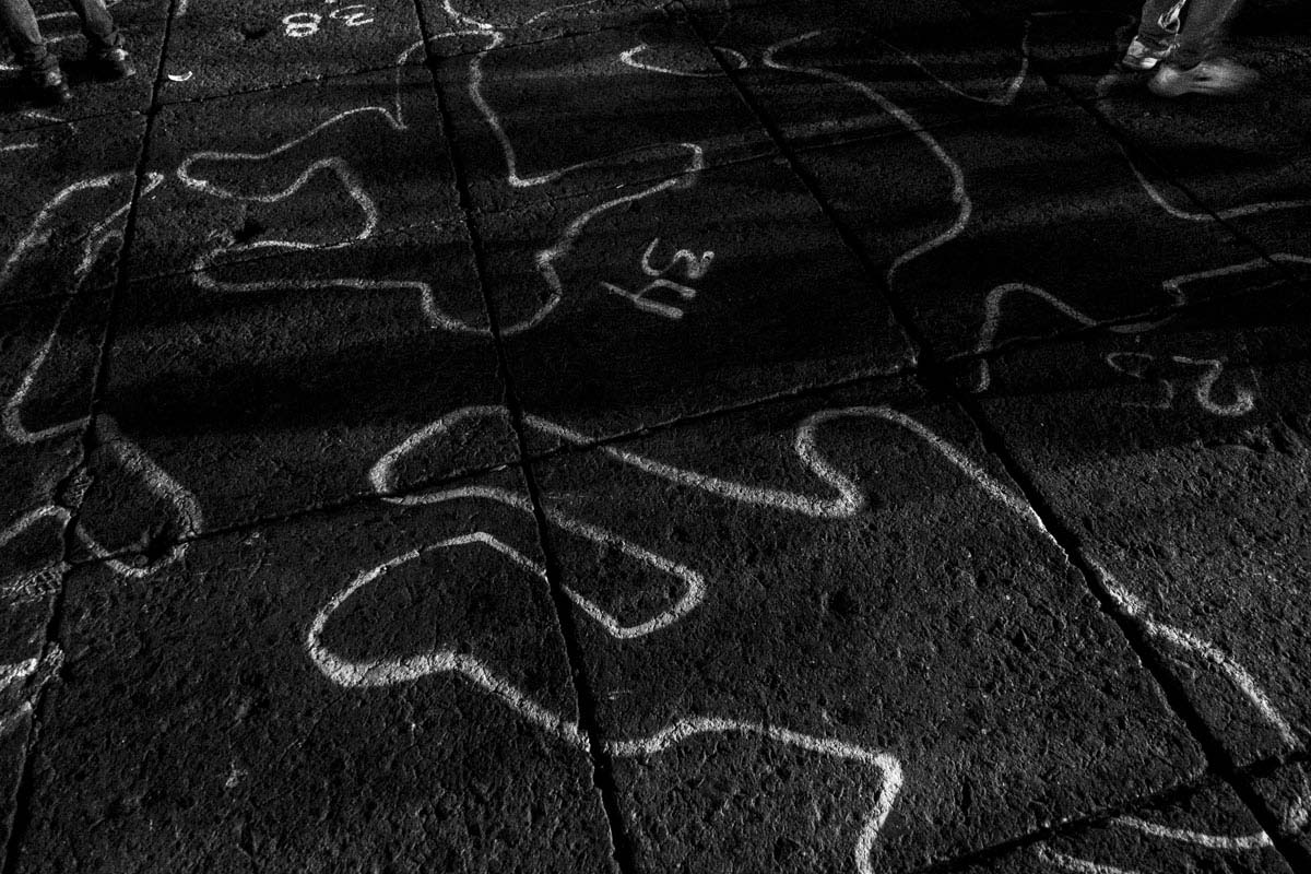 Chalk outlines representing the bodies of crime victims during a protest in Mexico City, November 5, 2014. The protestors demanded government accountability for the disappearance and alleged murder of 43 students from the rural state of Guerrero, one of the poorest in the country. Sebastian Liste—NOOR For TIME