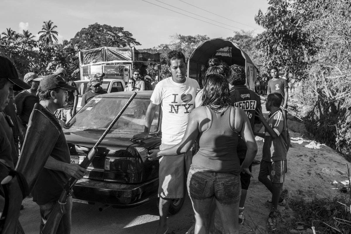 XALTIANGUIS, MEXICO - NOVEMER 2, 2014:Patrol of Community Police of Xaltianguis. It´s one of the biggest and more important in Guerrero State. They searched for the students immediately after they disappeared on September 26th in Iguala. Since then, the community has been demonstrating and blocking the road from Mexico DF to the touristic Acapulco. Here the community police search cars Sebastian Liste—NOOR FOR TIME