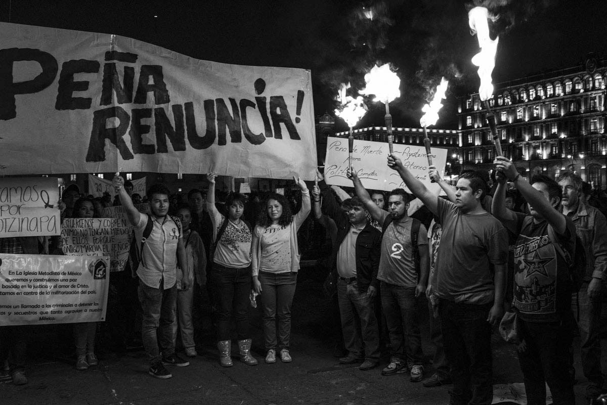 People rally on the streets of México City on November 5, 2014 demanding  an explanation from the government for what happened to the 43 students that went missing on September 26, 2014. The students attended the Raúl Isidro Burgos Rural teachers college of Ayotzinapa in Iguala Guerrero.Allegedly corrupt police in Iguala  worked for the Guerreros Unidos drug gang, which authorities charge had ties to the former mayor of Iguala, Jose Luis Abarca, and his wife, Maria de los Angeles Pineda.