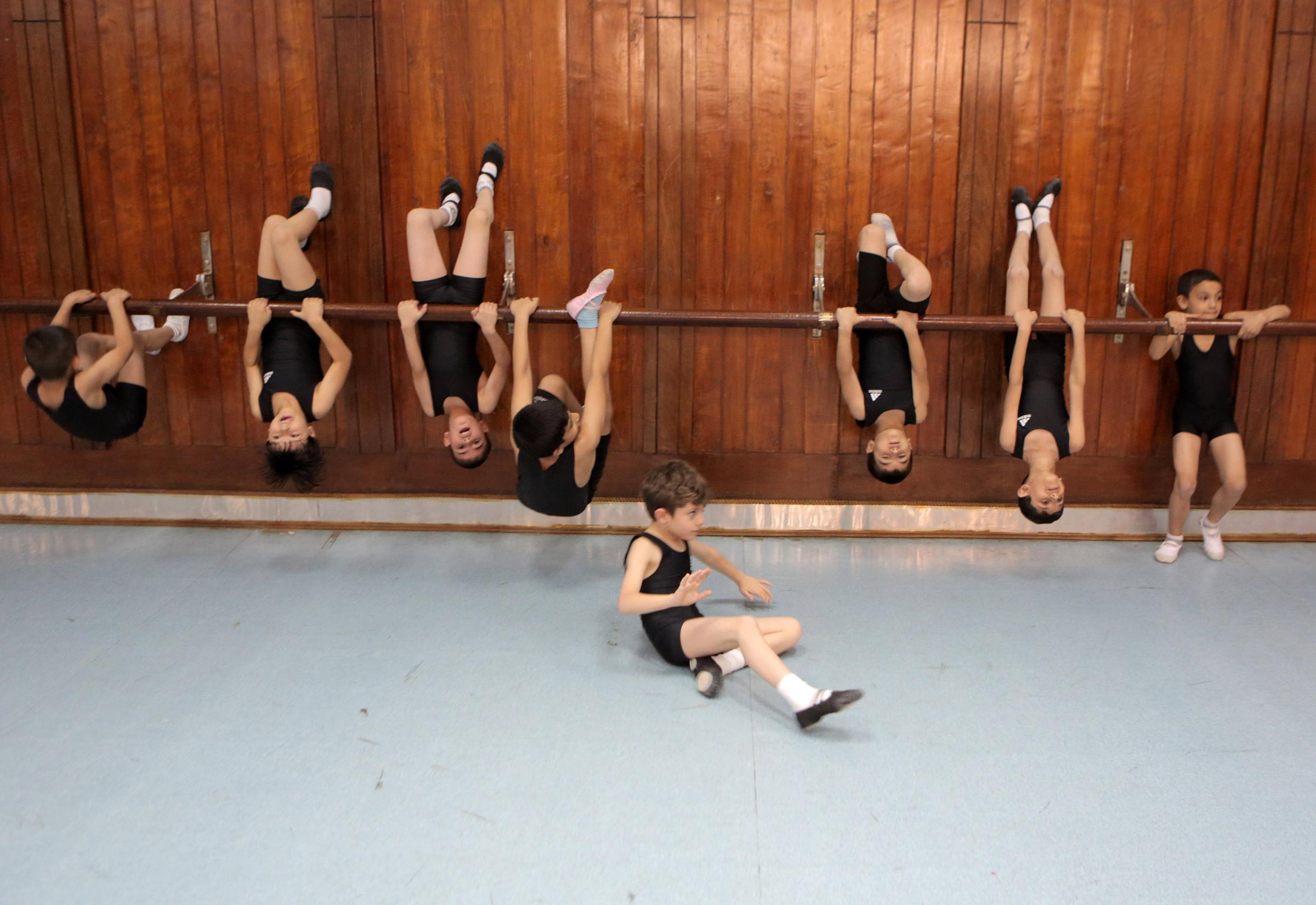 Young students practice at a dancing studio in the Baghdad School of Music and Ballet in Monsur district on, Nov. 12, 2014, in Baghdad.