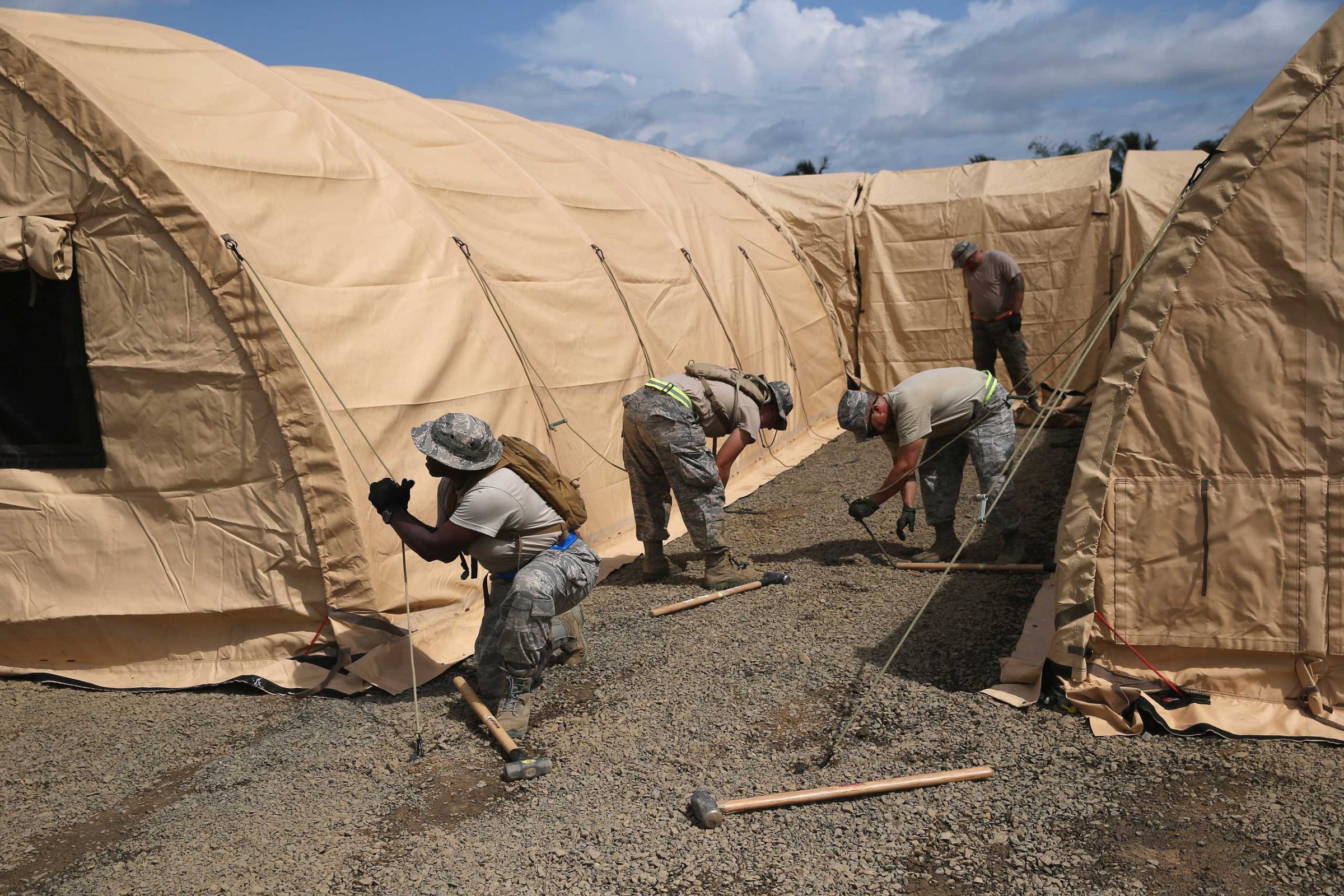 U.S. Air Force personnel put up tents to house a 25-bed U.S.-built hospital for sick Liberian health workers as part in Operation United Assistance on Oct. 9, 2014 in Monrovia, Liberia.