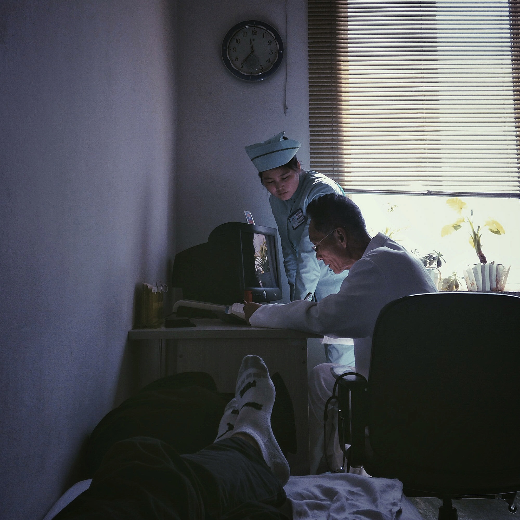A doctor and nurse consult one another at the Pyongyang Friendship Hospital for Foreigners.
