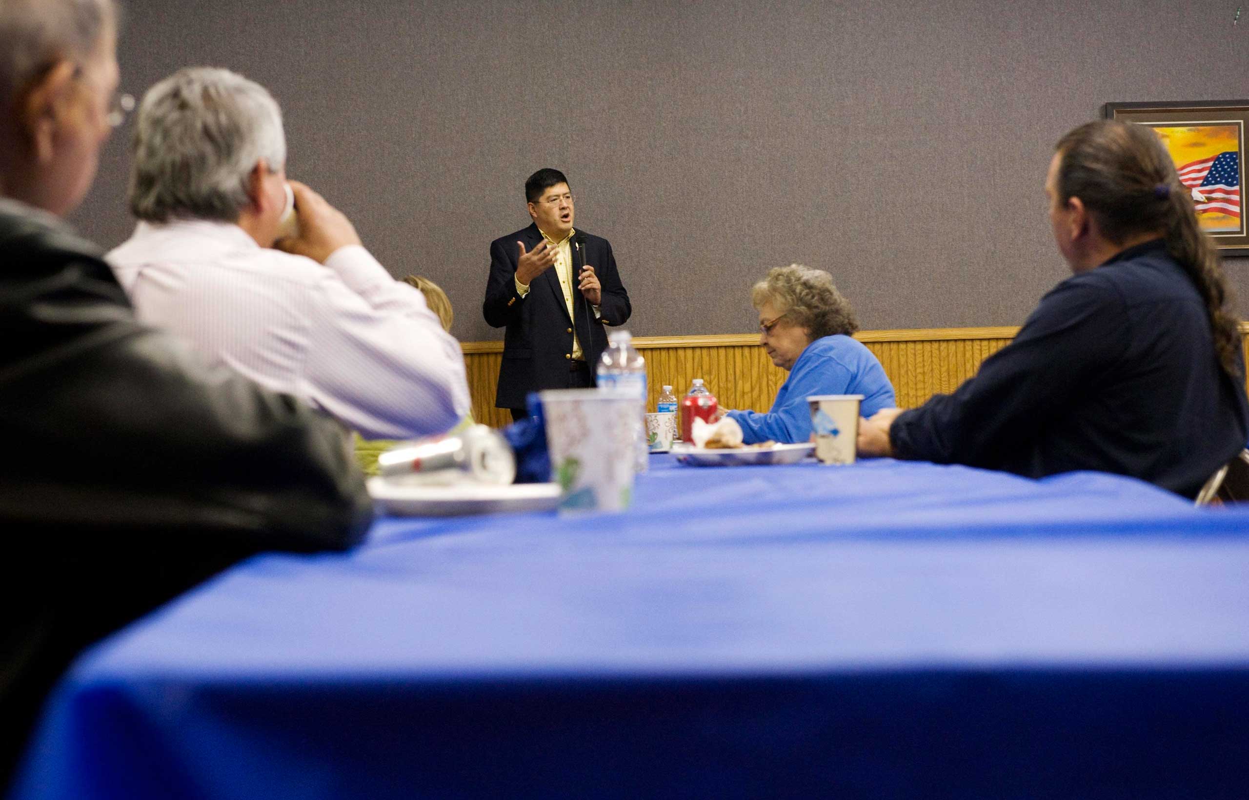 Three Affiliated Tribes council chairman candidate Damon Williams (C), speaks to supporters during a campaign dinner on the Fort Berthold Reservation in N.D. on Nov. 1, 2014.