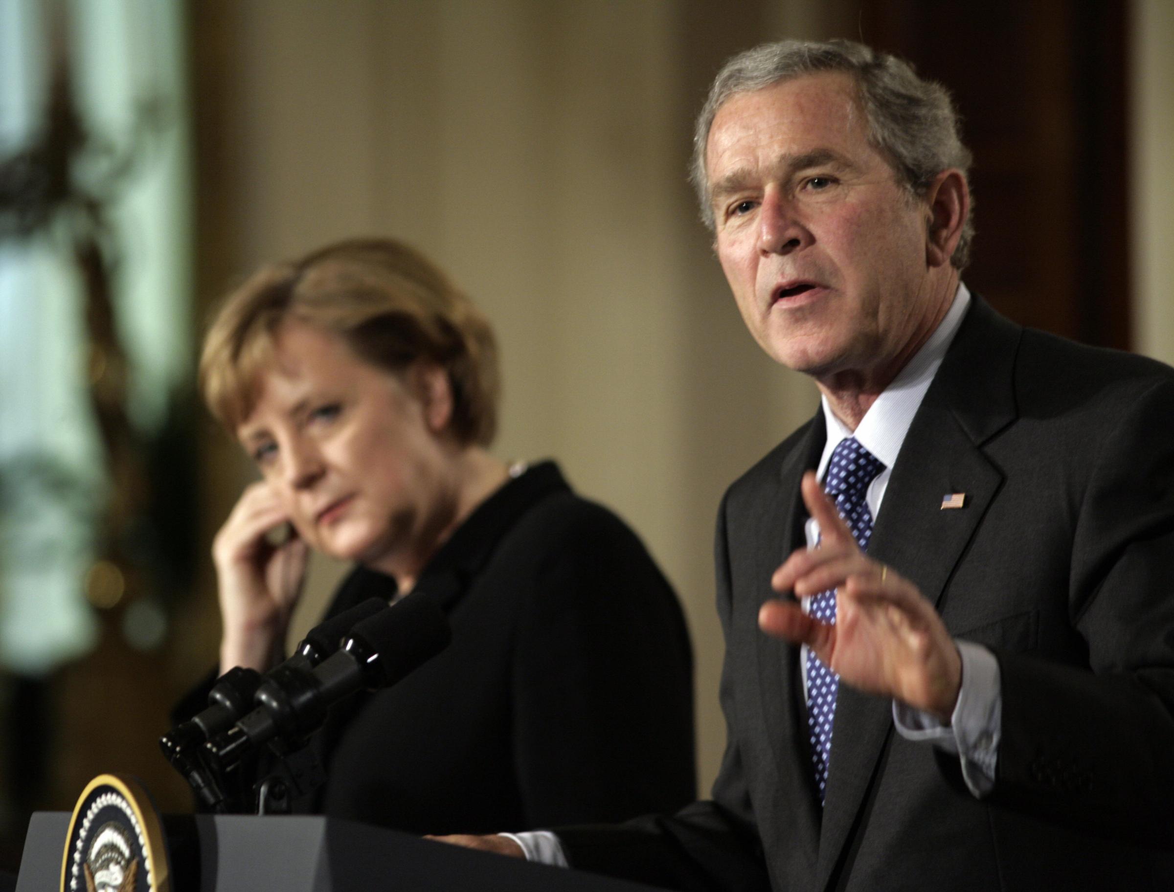 President George W. Bush speaks during a joint press conference with German Chancellor Angela Merkel on Jan. 13, 2006 in the East Room of the White House in Washington D.C.