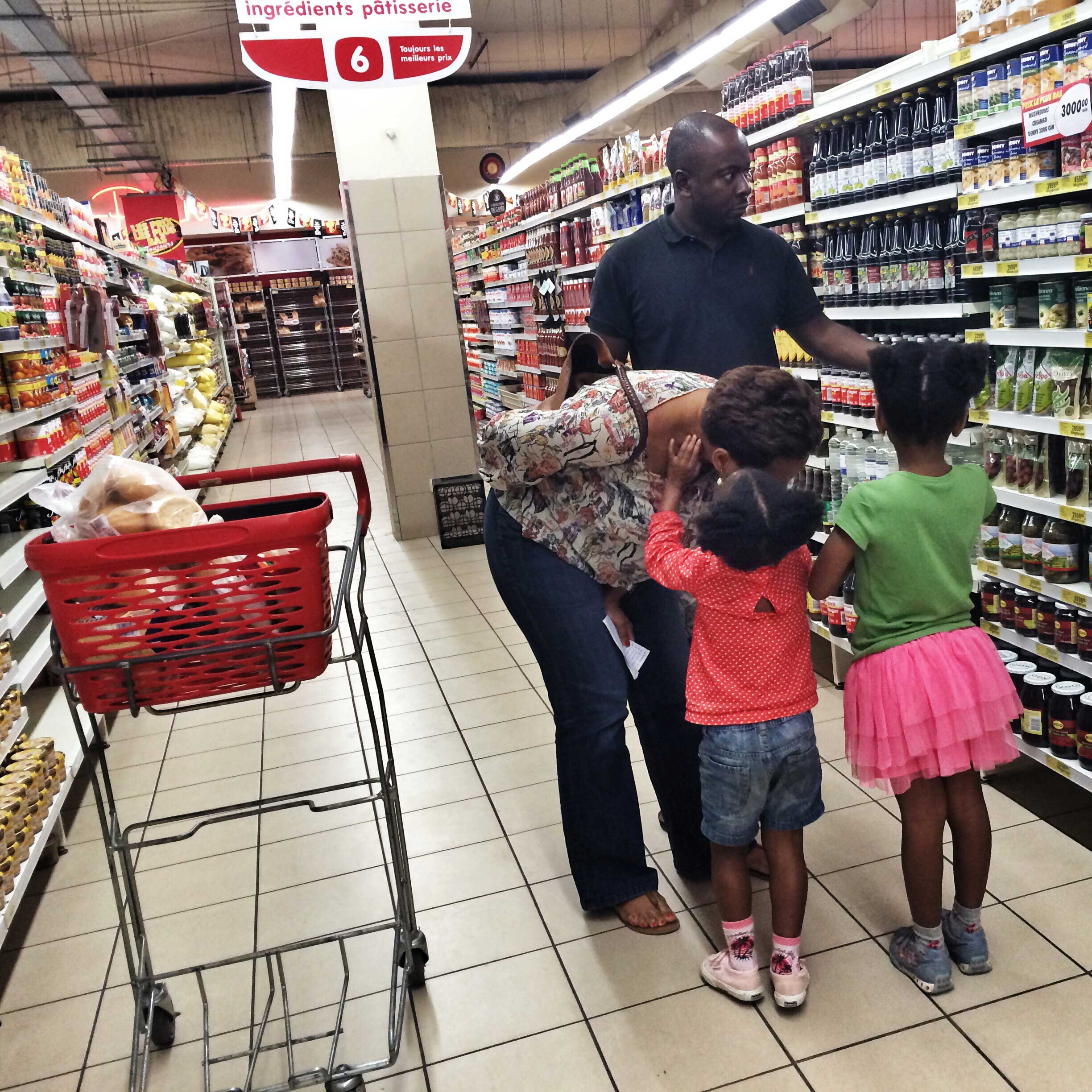 A family shops in a supermarket in Kinshasa, Democratic Republic of Congo, July 4th, 2014.
