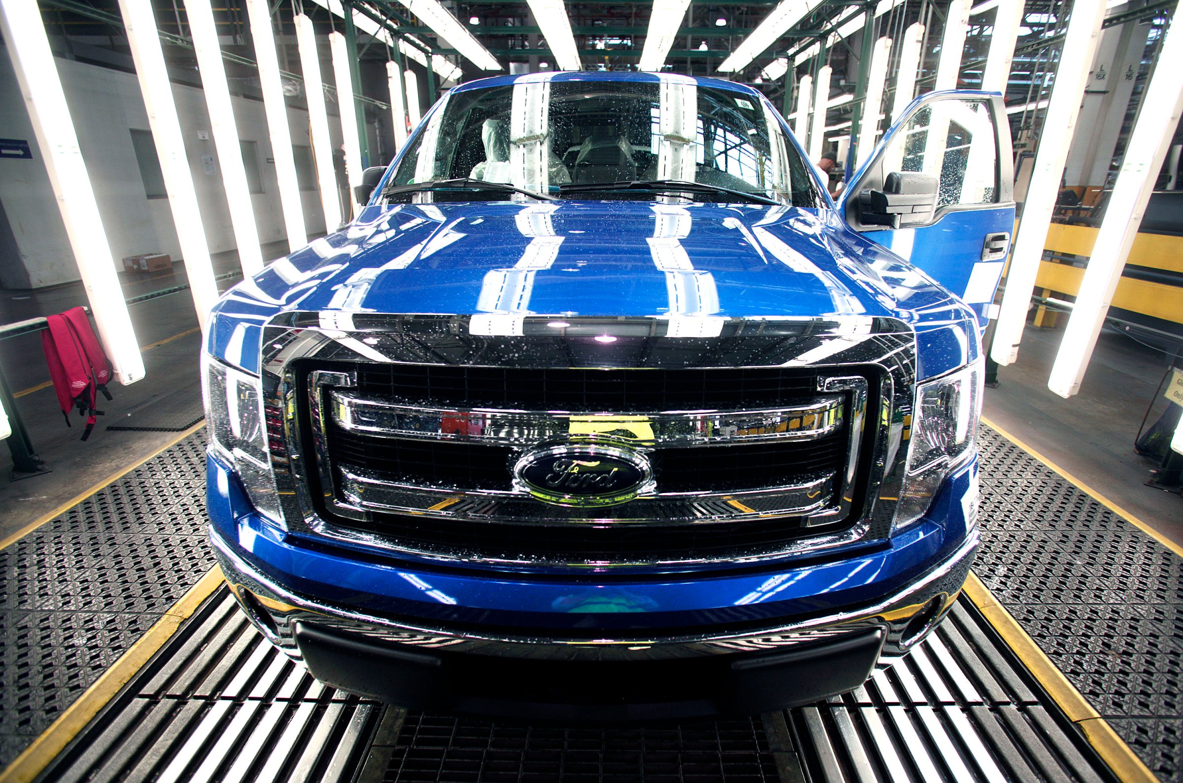 A new 2014 Ford F-150 truck exits a quality control inspection after undergoing assembly at the Ford Dearborn Truck Plant on June 13, 2014 in Dearborn, Mich.