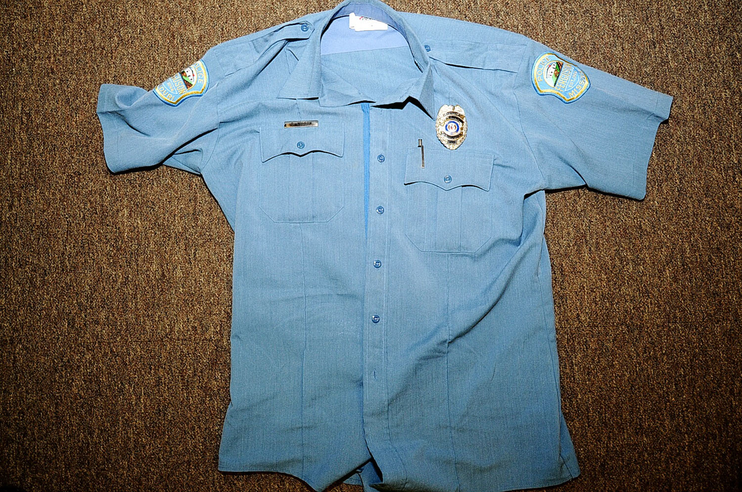 An undated evidence photograph made available by the St. Louis County prosecutors office on Nov. 25, 2014 shows Ferguson police officer Darren Wilson's uniform taken after the shooting of Michael Brown.