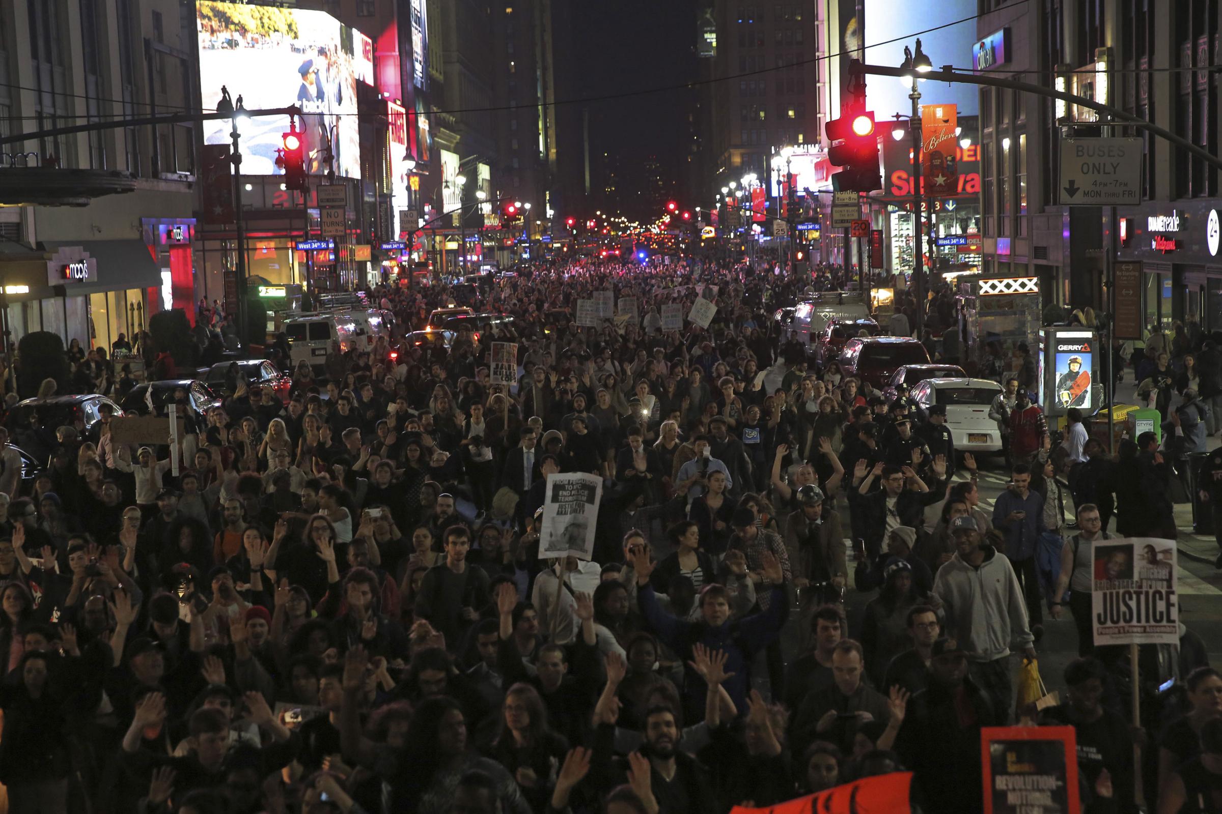 Protesters march near Times Square in New York City on Nov. 24, 2014.