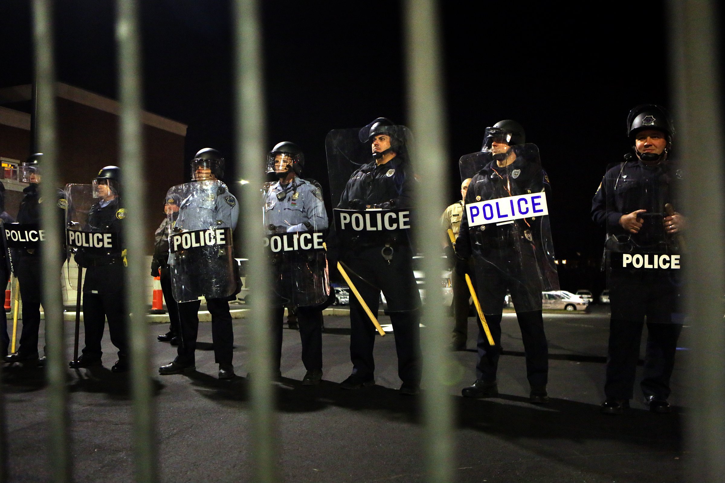 Police form a line opposite of protesters in front of the police station on Nov. 19, 2014. (Huy Mach—St. Louis Post-Dispatch/Polaris)