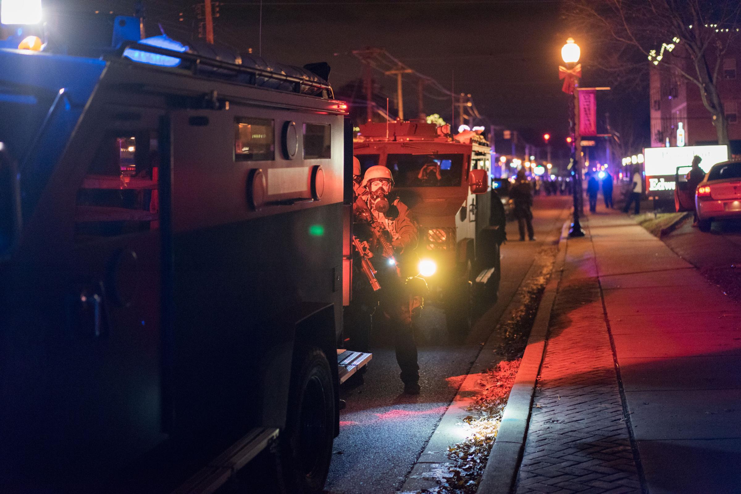 Law enforcement responds to protestors amidst tear gas and smoke in Ferguson, Mo. on Nov. 24, 2014