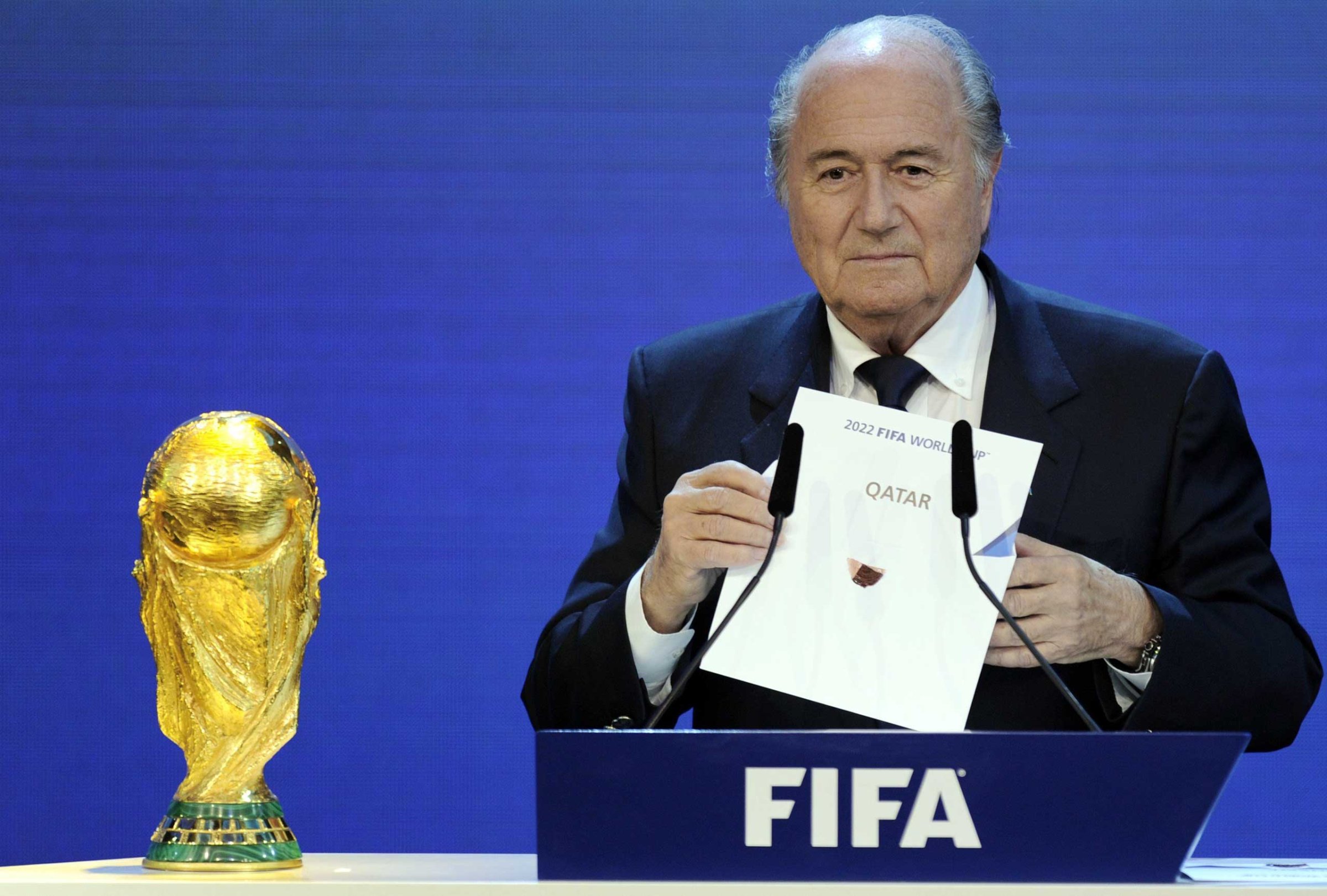 FIFA President Sepp Blatter holding up the name of Qatar during the official announcement of the 2022 World Cup host country at the FIFA headquarters in Zurich, Dec. 2, 2010.