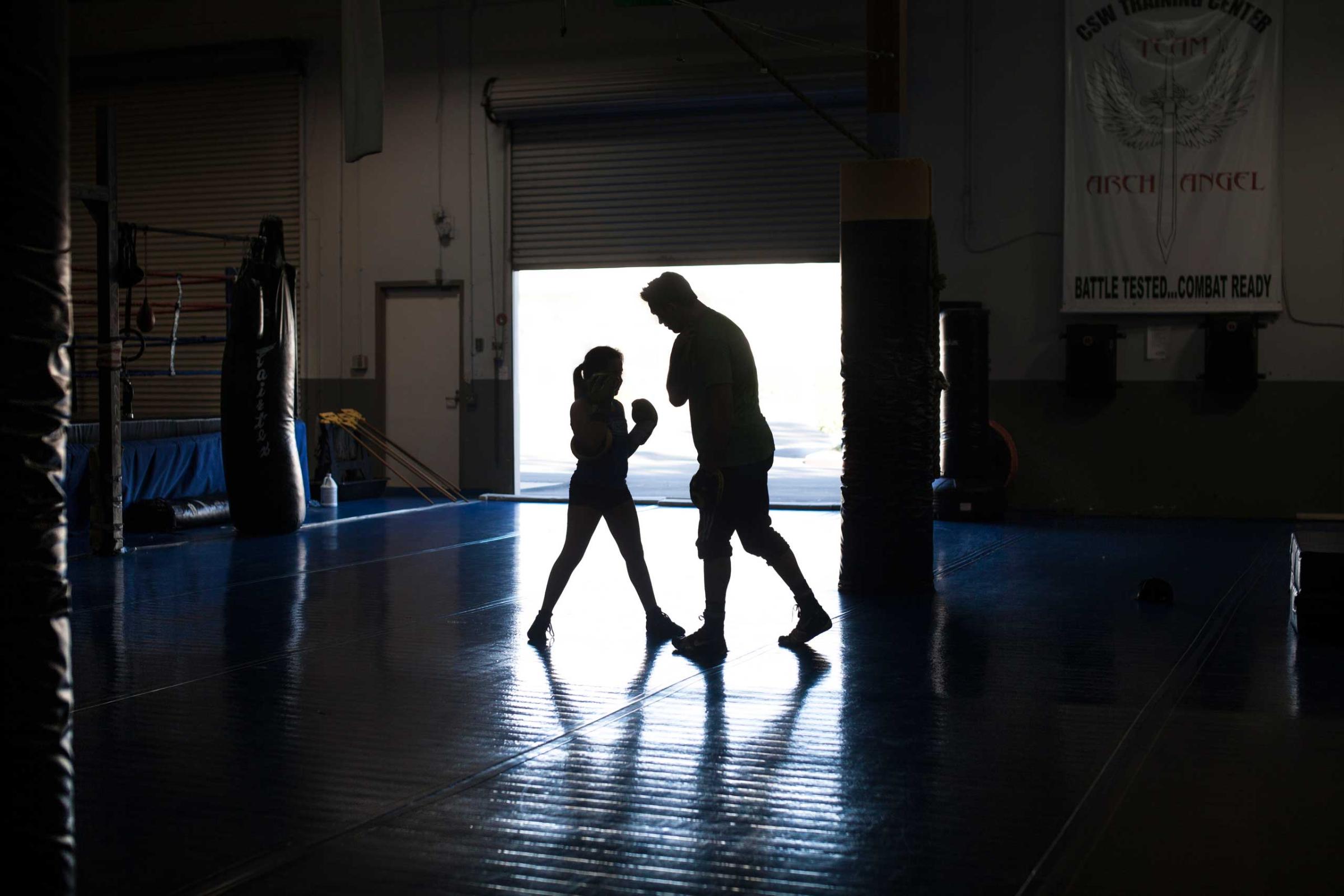 Cheyenne Bowman, 11, at personal MMA practice with coach Craig Wilkerson, a professional MMA fighter. La Habra, Calif,. Nov. 2013.