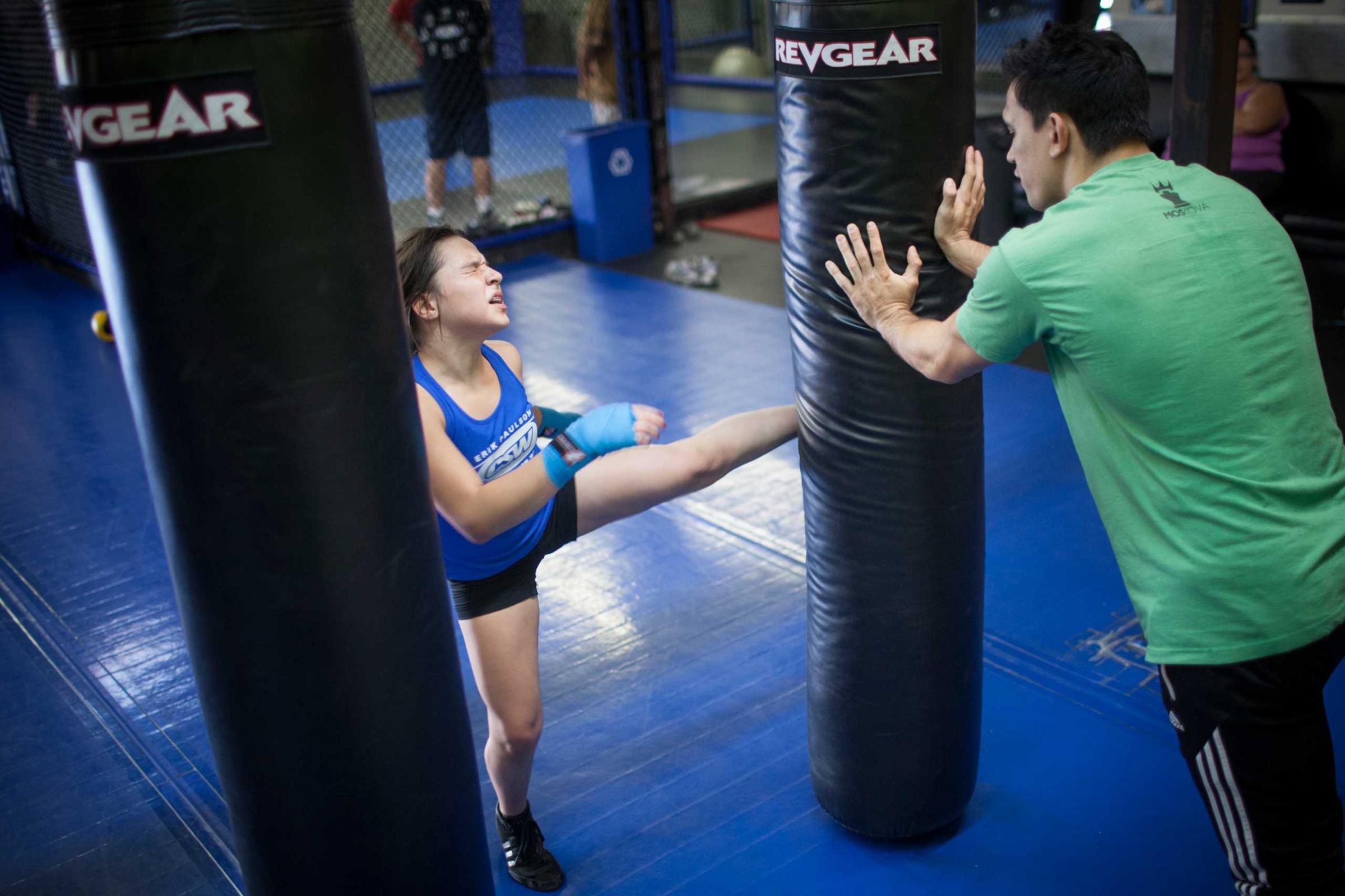 Cheyenne Bowman, 11, at personal MMA practice with coach Craig Wilkerson, a professional MMA fighter. La Habra, CA. November 11th 2013. Photo: Miikka Pirinen