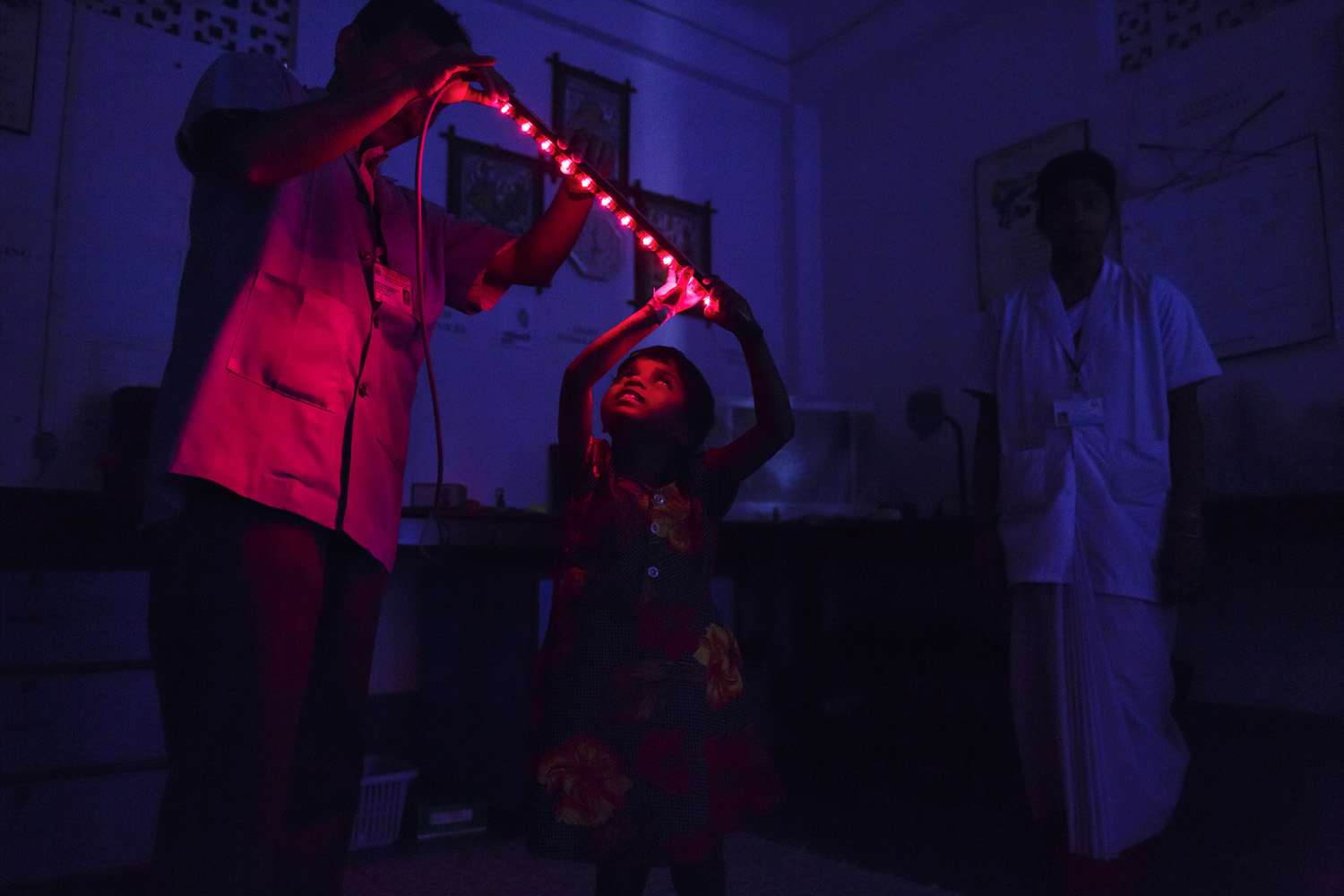 Anita Singh goes through eye stimulation light tests after eye surgery at Vivekananda Mission Hospital, Oct. 26, 2013 in West Bengal, India.