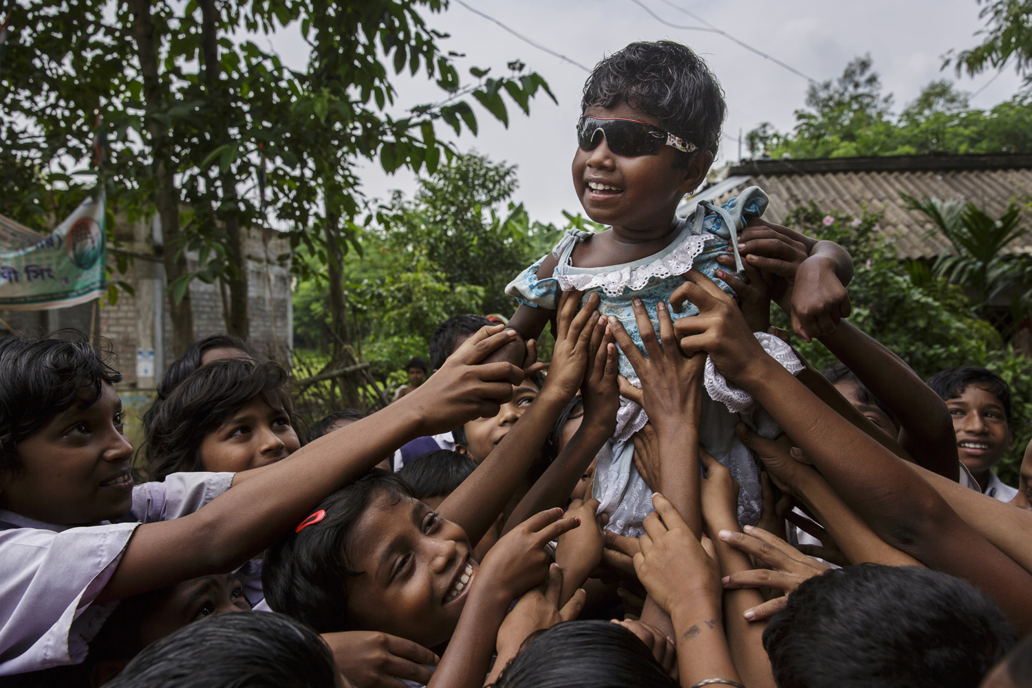 Anita Singh is feted by schoolchildren in her village, Oct. 26, 2013, West Bengal, India.