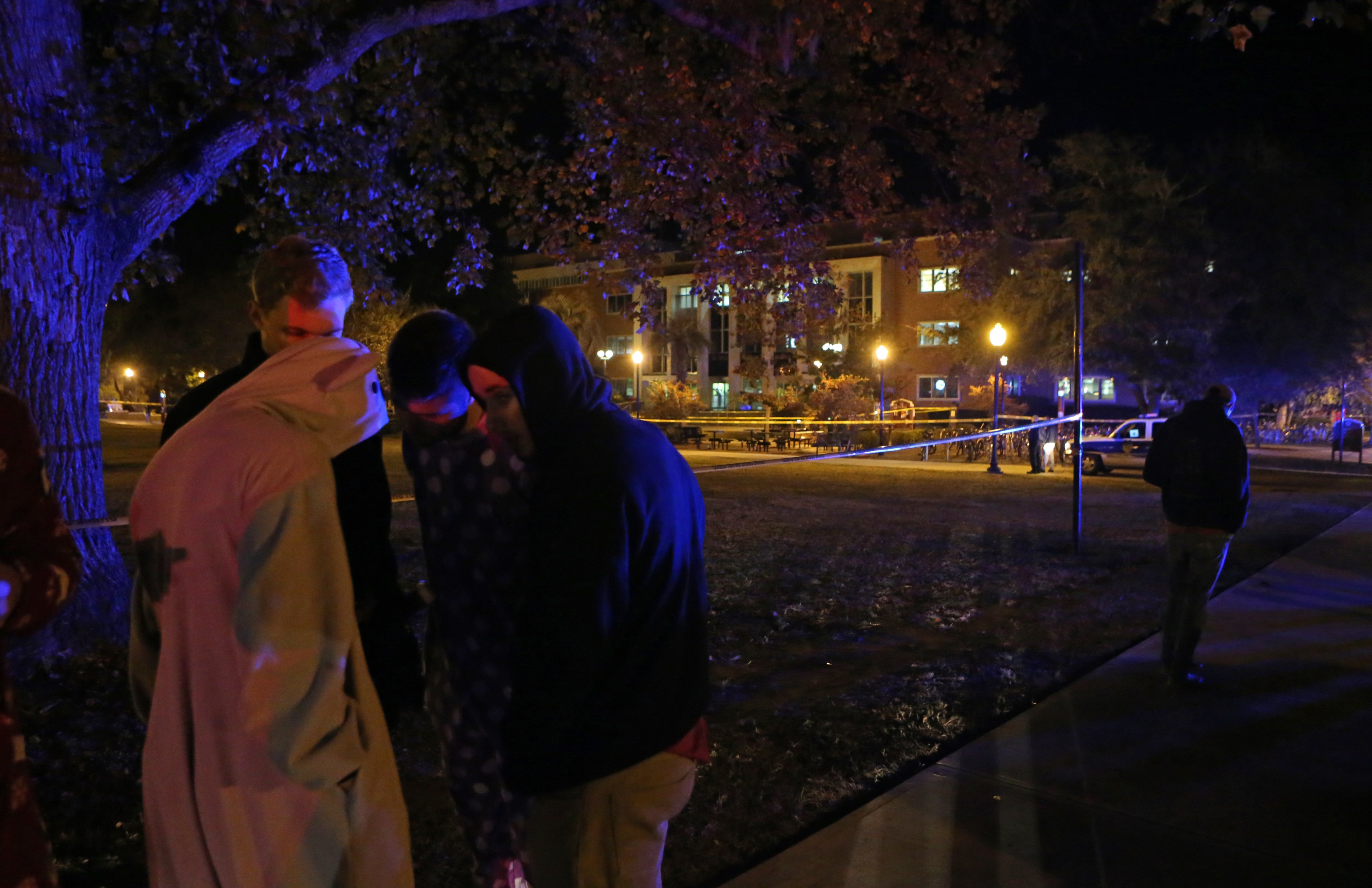 Students call their friends still locked down in Strozier Library after a shooting at Florida State University in Tallahassee, Fla., on Nov. 20, 2014 (Steven Cannon—AP)