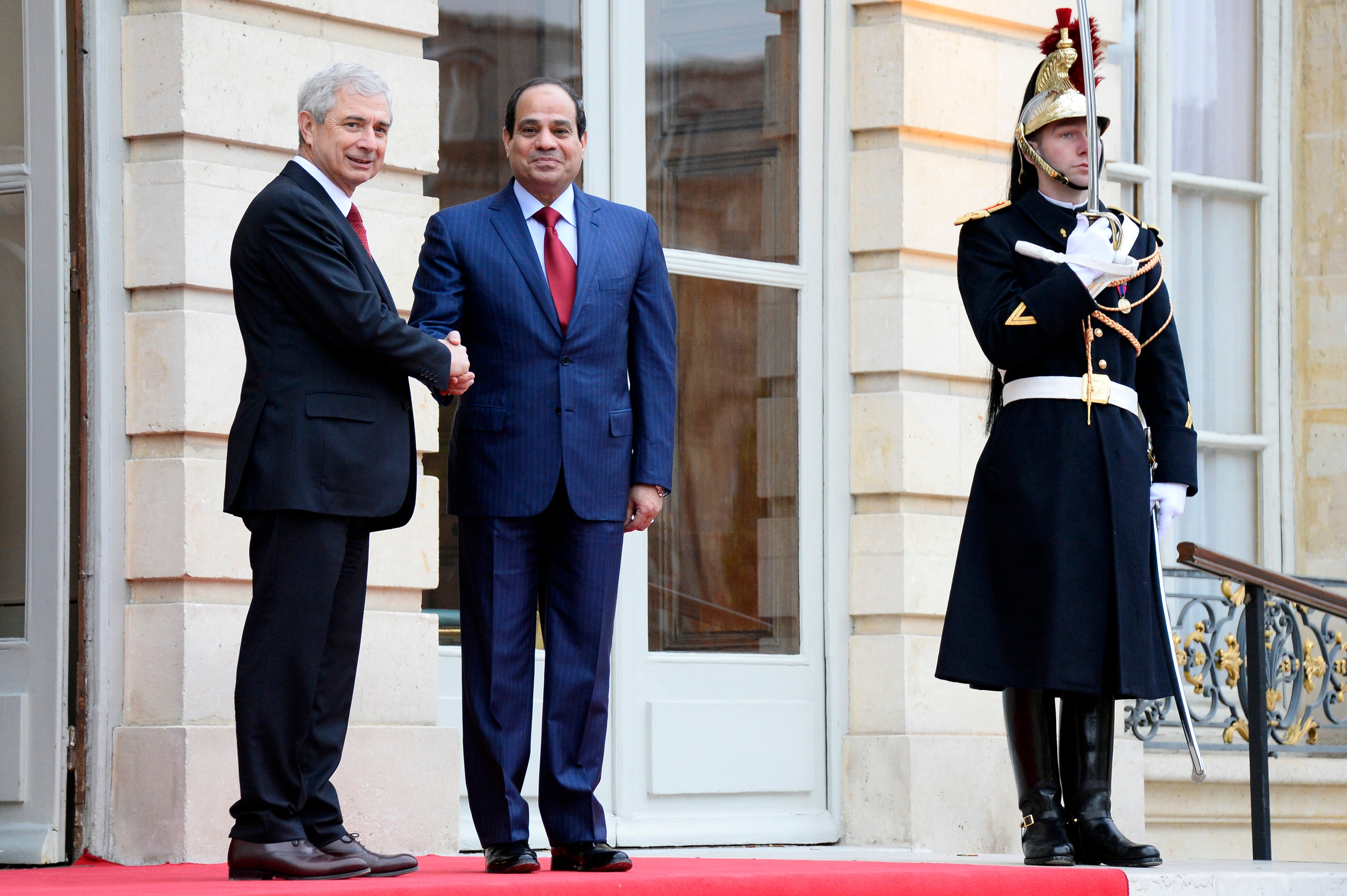 French National Assembly President Claude Bartolone, left, welcomes Egyptian President Abdul Fattah al-Sisi before their talks in Paris on Nov. 27, 2014 (Bertrand Guay—AP)