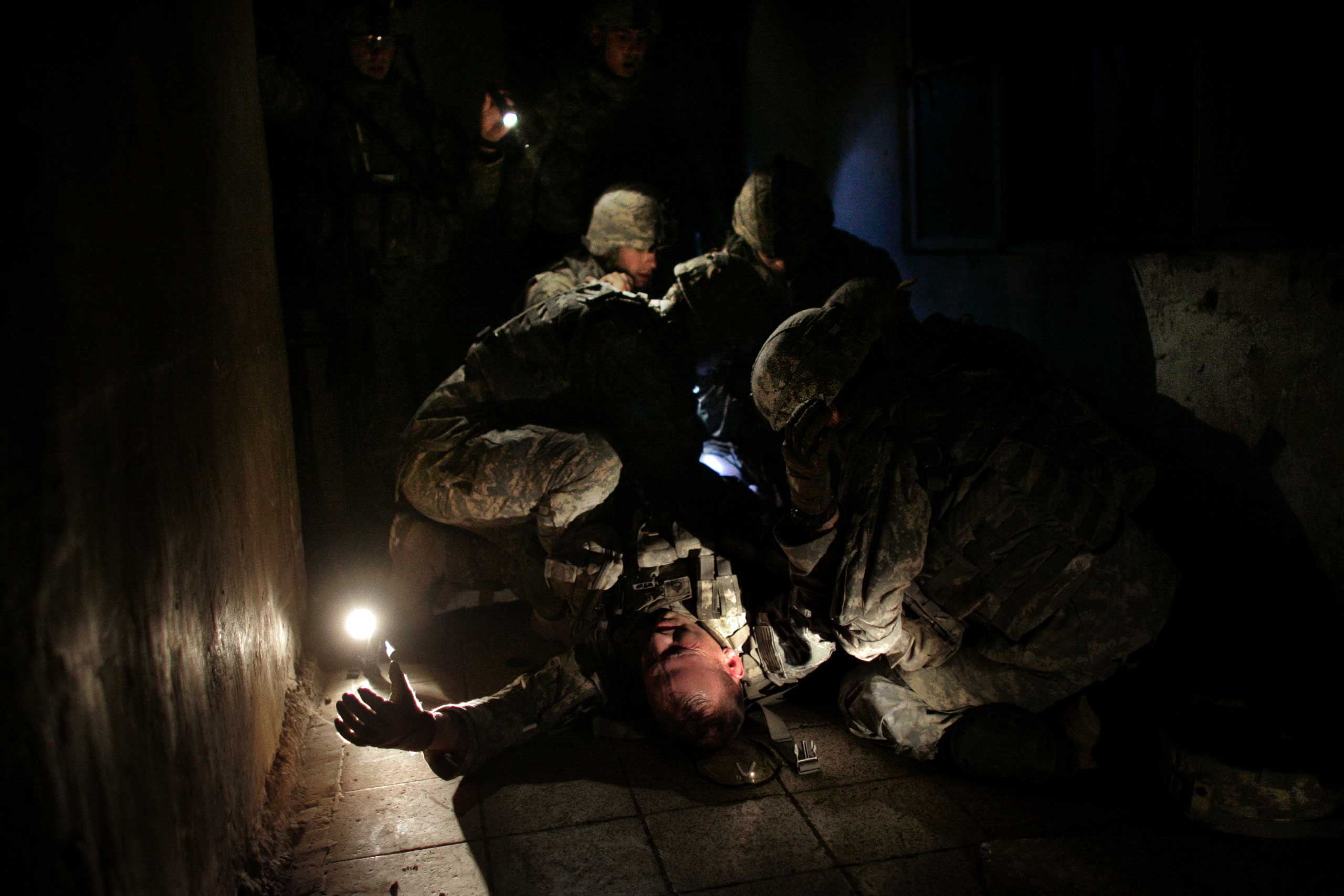 Staff Sergeant David Brown.
                              David Furst,
                              March 22, 2007. Baghdad, Iraq.
                              
                               U.S. soldiers provide first aid to Staff Sergeant David Brown on March 22, 2007. Brown was shot in the leg while securing the area around a weapons cache found on patrol in the Dora neighborhood of southern Baghdad.
                              
                              When I see this image, I’m instantly transported back in time. I was a young photographer with Agence France-Presse when gunmen unexpectedly opened fire on the unit I was embedded with. Suddenly I felt someone grab me by the back of my flak jacket and hurl me into a doorway toward the cover of a concrete wall. Brown fell on top of me as a bullet hit him in the thigh. The stranger who saved my life was now bleeding heavily.
                              
                              Brown eventually recovered from his wounds and returned to Iraq. But his lighting quick actions that day reflected a professionalism as well as an instinct to protect others. It didn’t matter that I wasn’t in uniform, and that he barely knew me: Brown’s first thought was to help the person beside him.