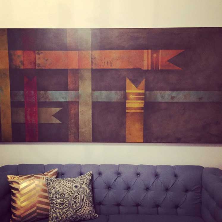 The ugliest painting in the world will make people want to buy our house. One Instagram comment summed it up as "abstract snake bookmark plaid." And a shiny gold chevron pillow.