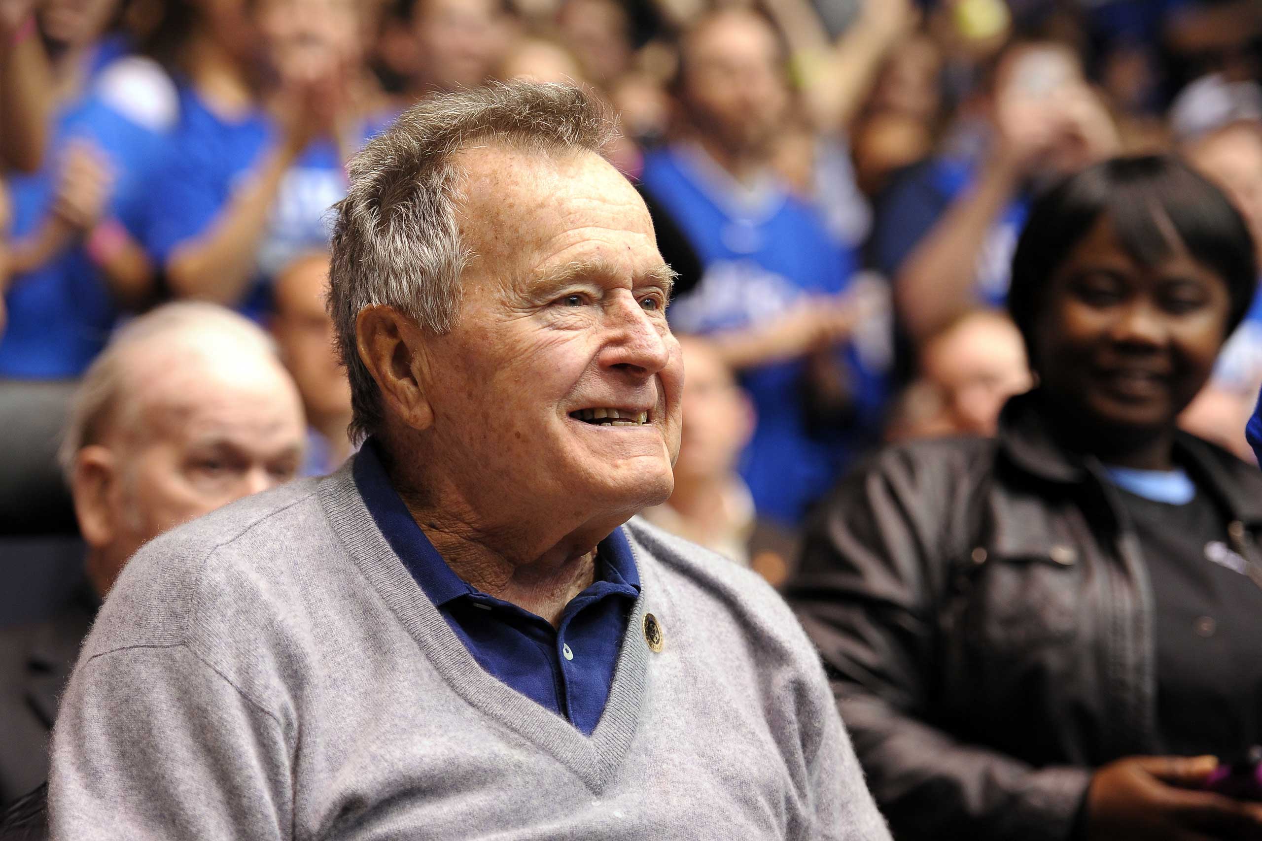 Former U.S. President George H.W. Bush looks on during a game between the North Carolina State Wolfpack and the Duke Blue Devils at Cameron Indoor Stadium in Durham, N.C., on Jan. 18, 2014 (Lance King—Getty Images)