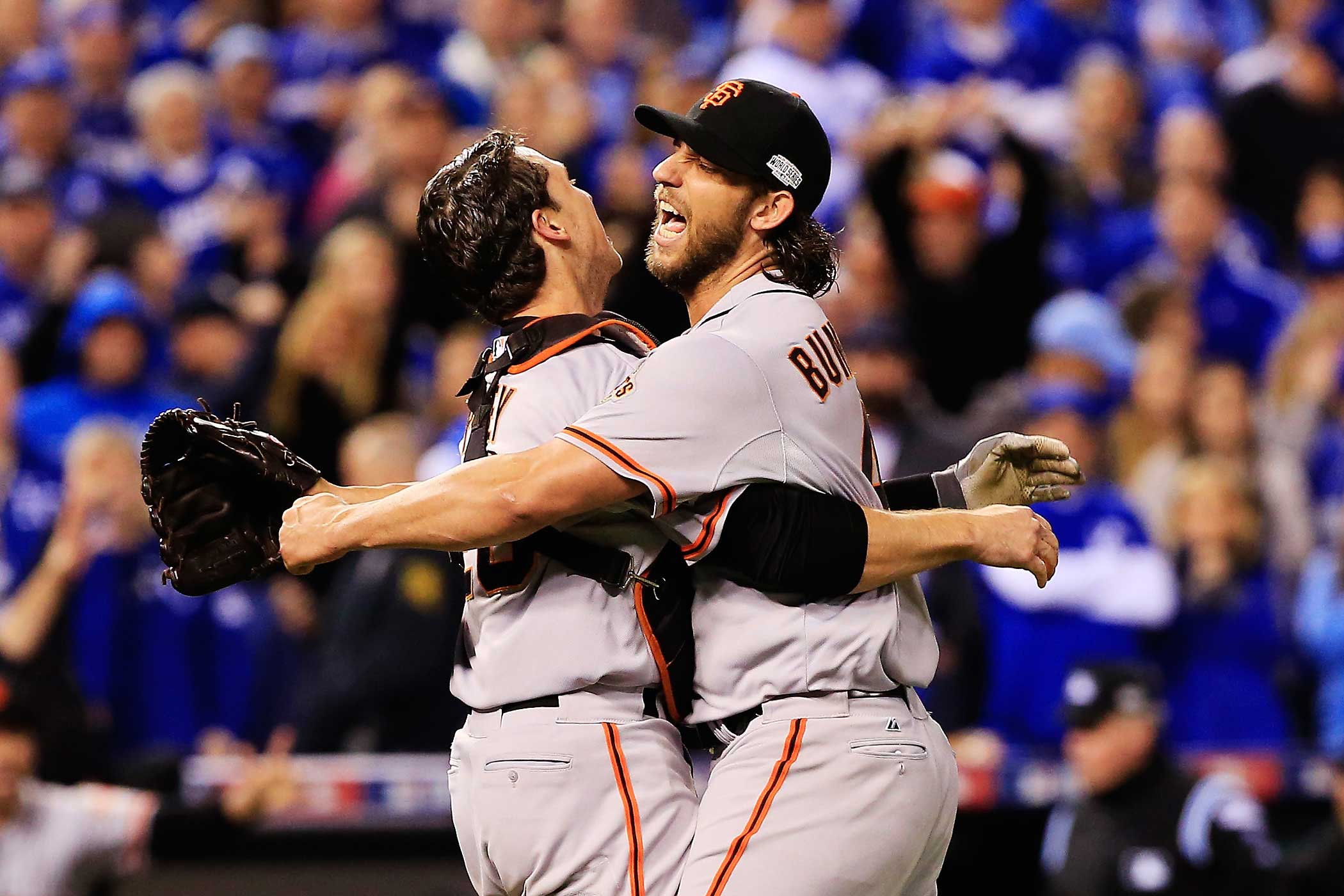 Buster Posey and Madison Bumgarner of the San Francisco Giants celebrate after defeating the Kansas City Royals to win Game Seven of the 2014 World Series by a score of 3-2 at Kauffman Stadium on October 29, 2014 in Kansas City, Missouri. (Jamie Squire—Getty Images)