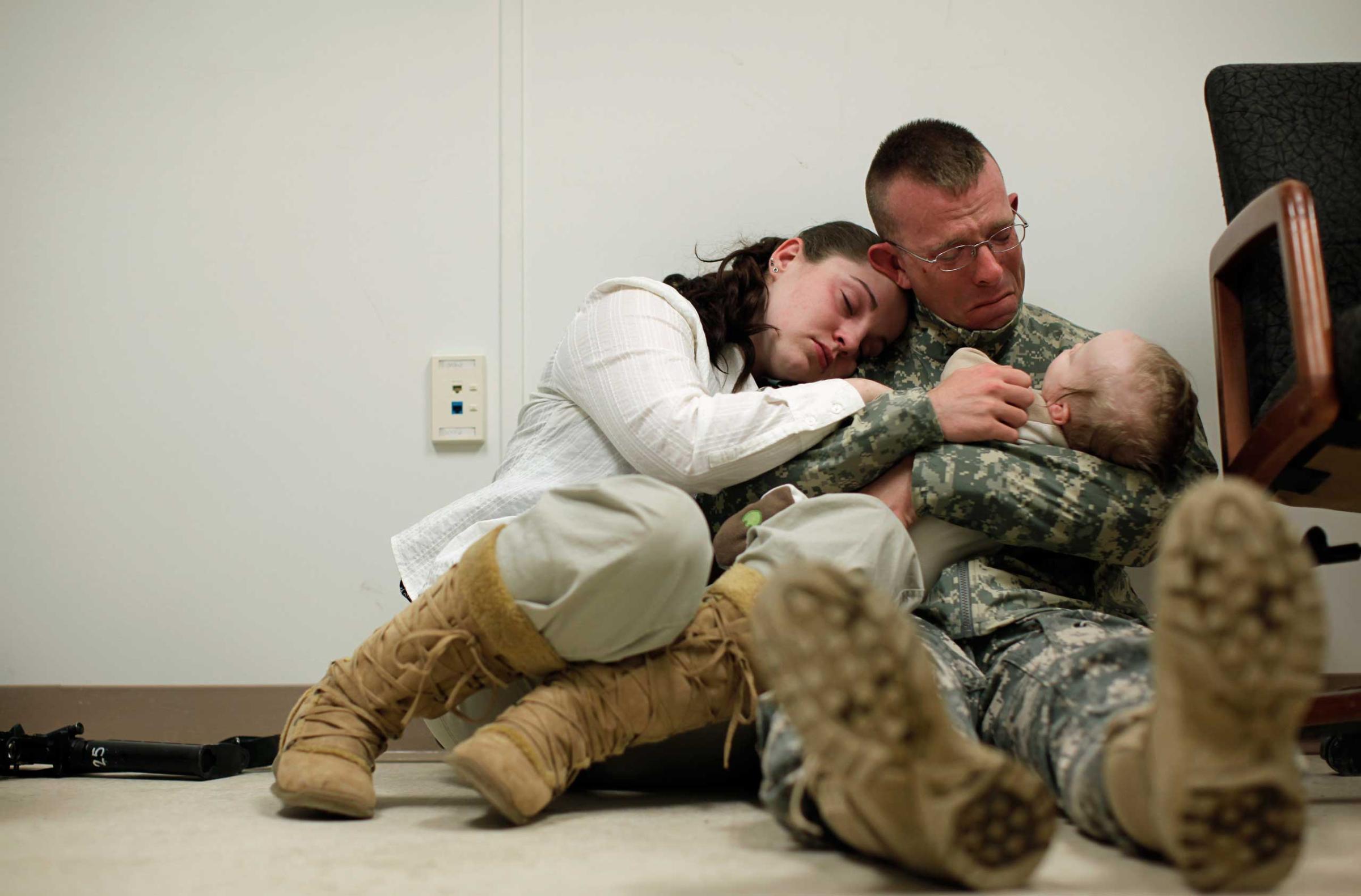 Sgt. Brian Keith with his wife, Sara, and their son, Stephen, 6 months, at Fort Drum, N.Y.