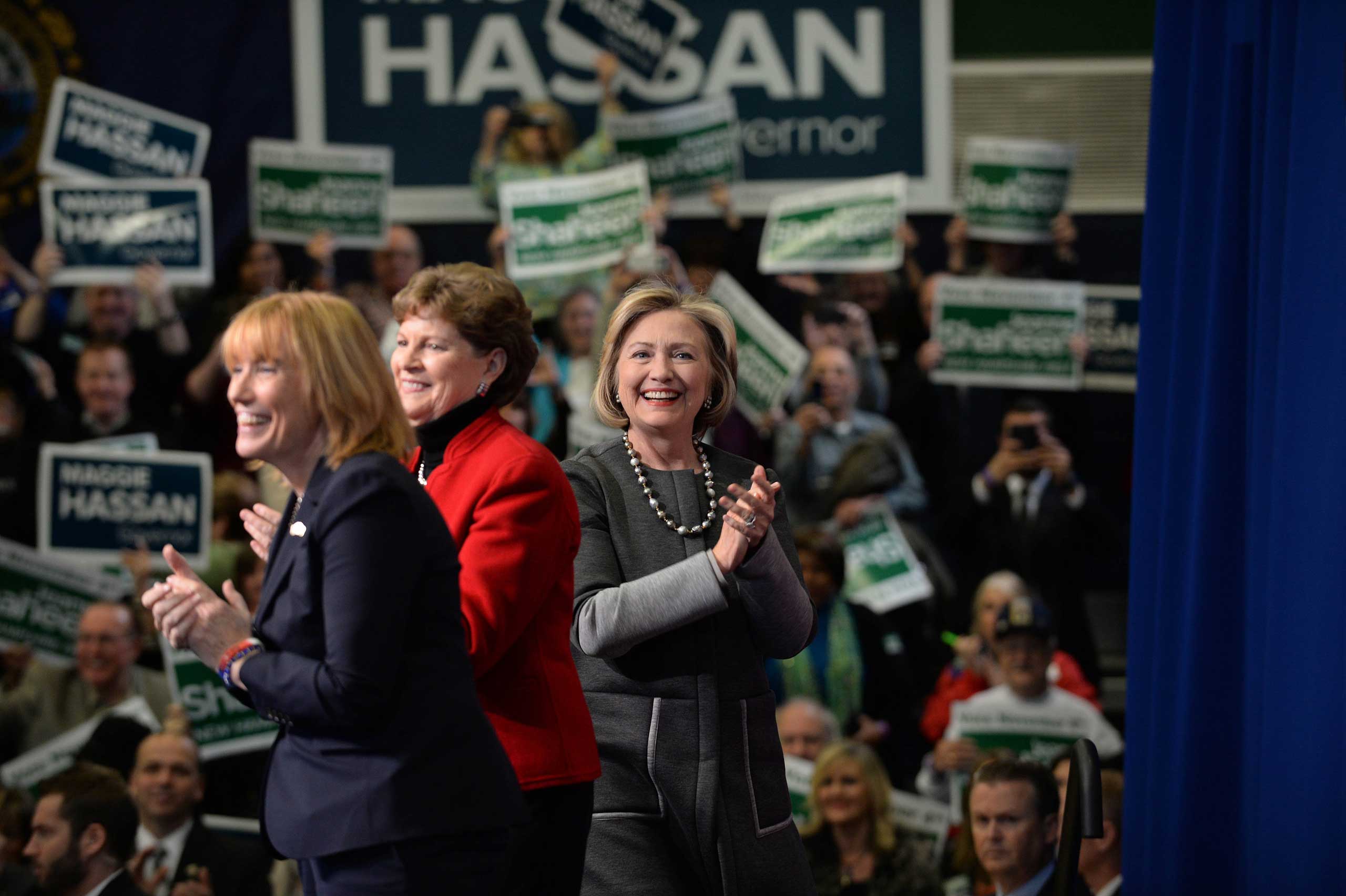 Former U.S. Secretary of State Hillary Clinton (R) campaigns with U.S. Senator Jeanne Shaheen (D-NH) and New Hampshire Governor Maggie Hassan (L) at Nashua Community College in Nashua, N.H. on Nov. 2, 2014. (Darren McCollester—Getty Images)
