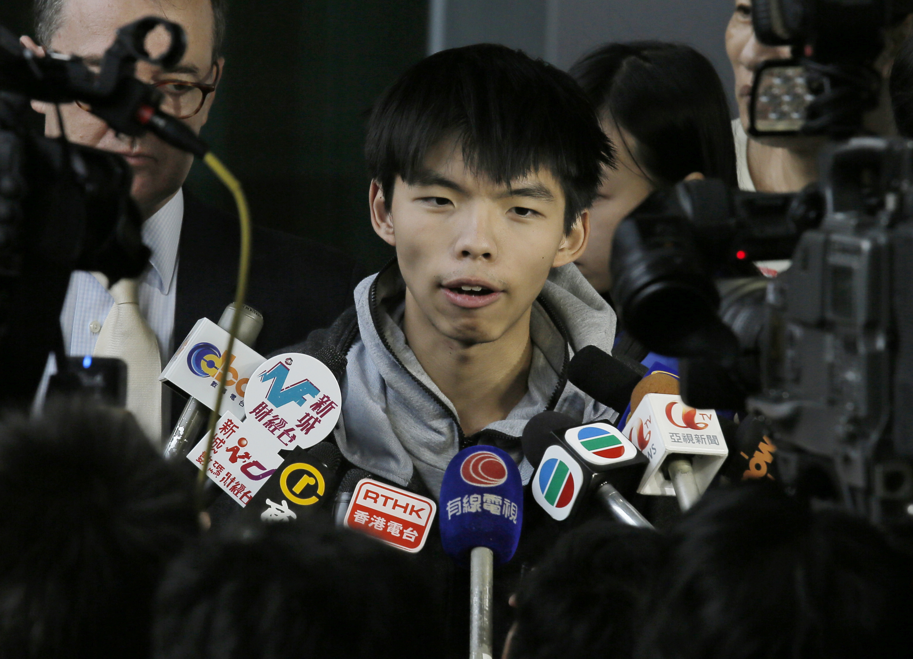Prominent Hong Kong student protest leader Joshua Wong talks to reporters outside a court in Hong Kong on Nov. 27, 2014 (Vincent Yu—AP)