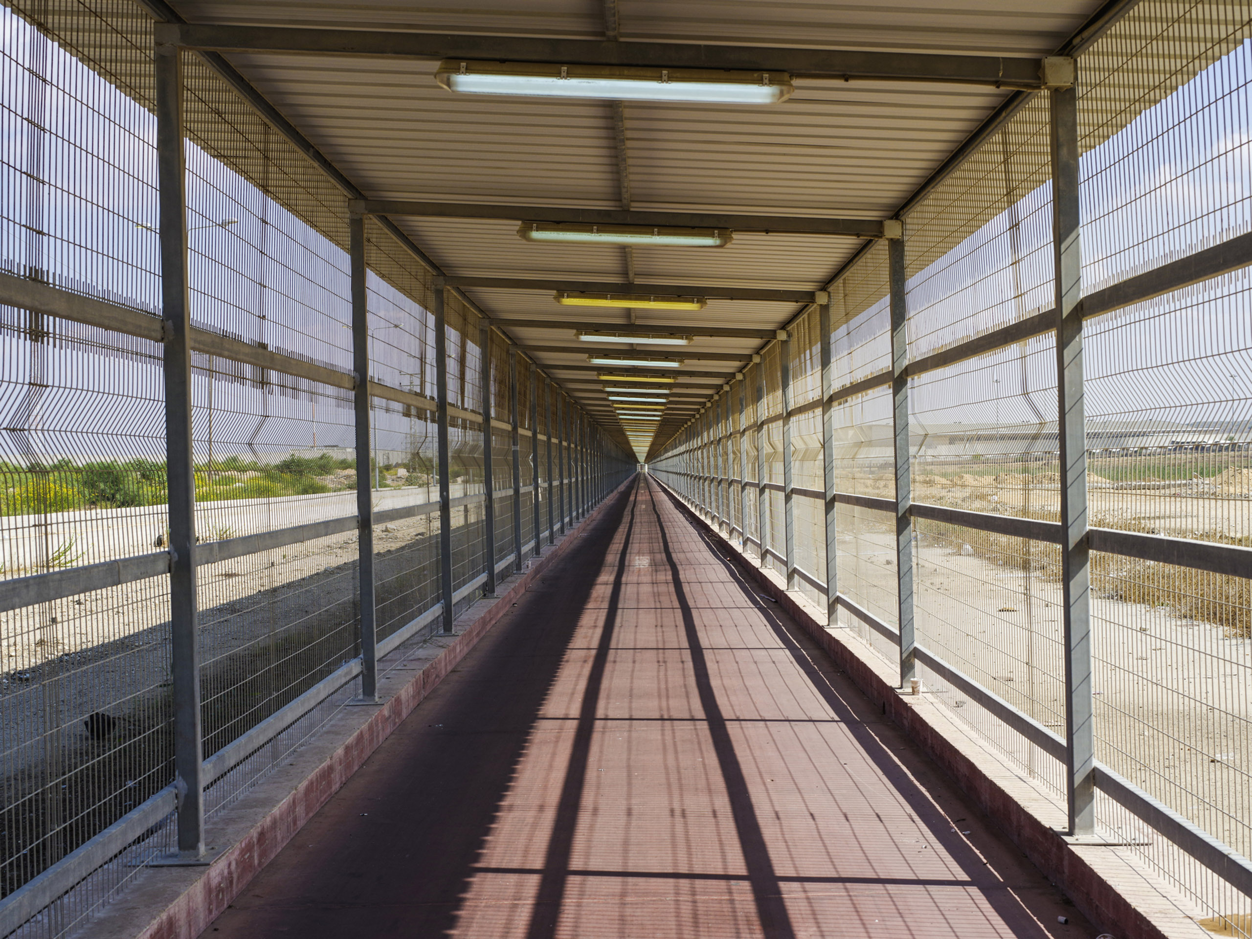 A caged path leads into and out of Gaza from the Erez crossing in Israel.