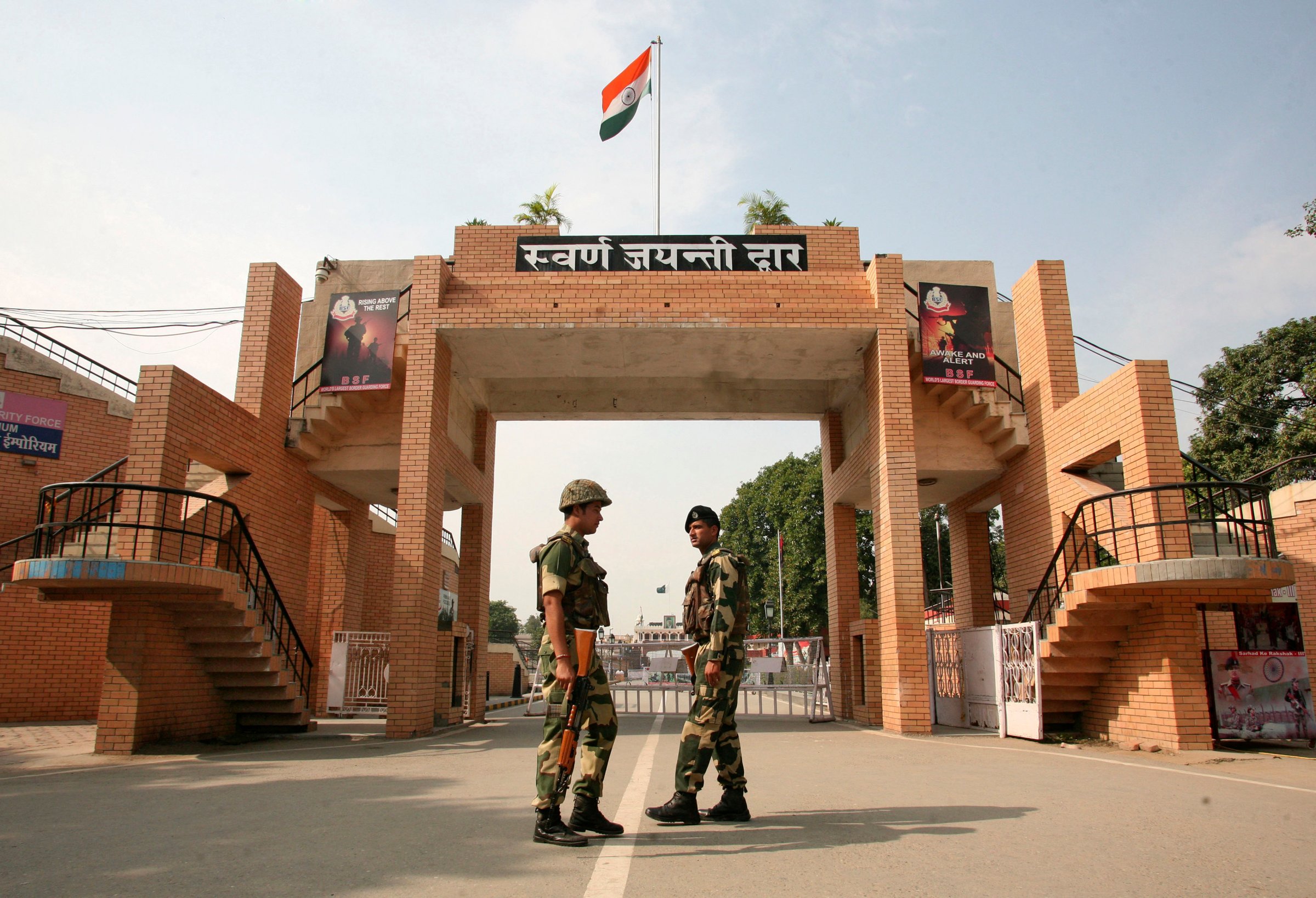 India's BSF soldiers patrol in front of the golden jubilee gate at the Wagah border
