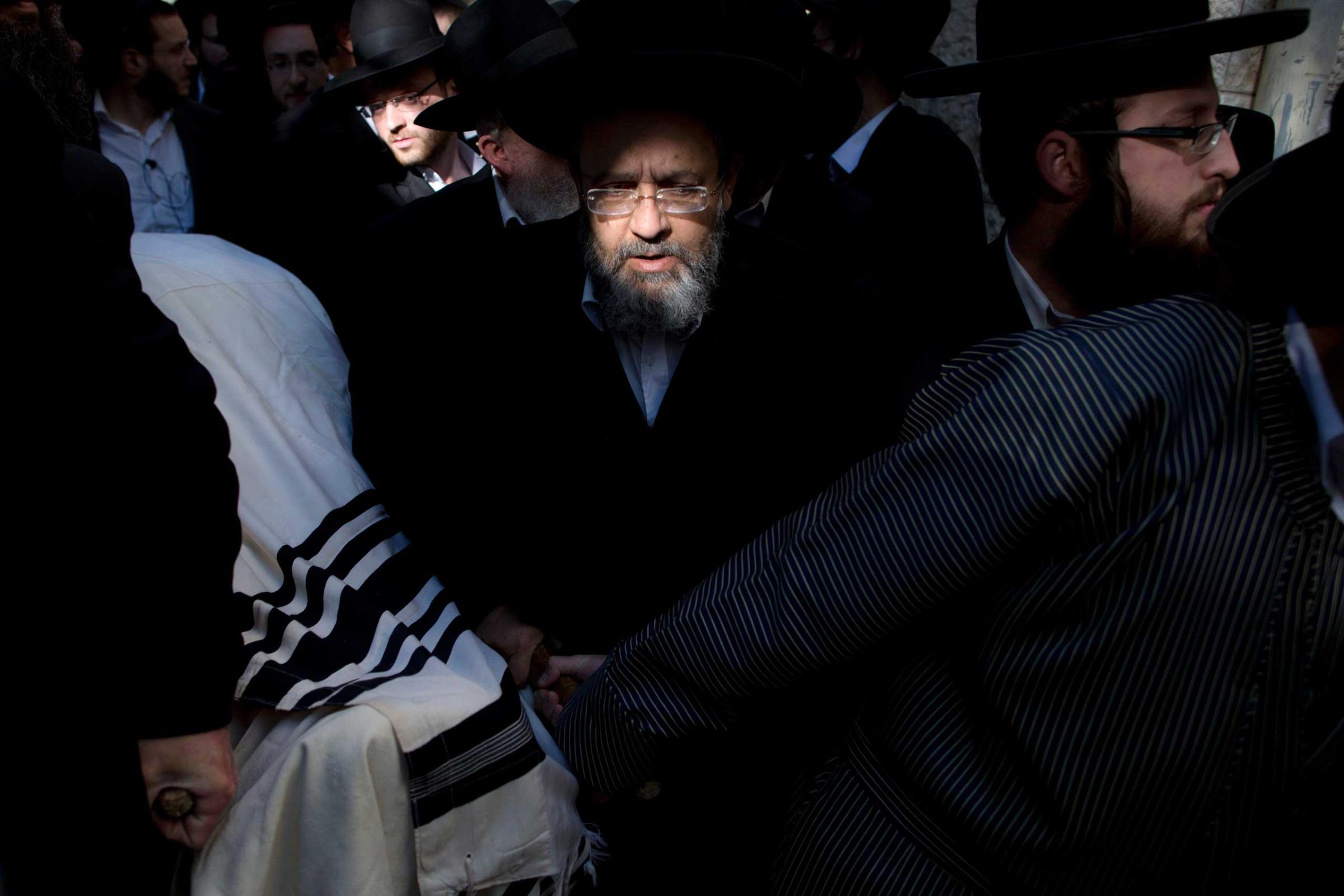 Ultra-Orthodox Jews carry the body of Mosheh Twersky during his funeral in Jerusalem, Nov. 18, 2014.