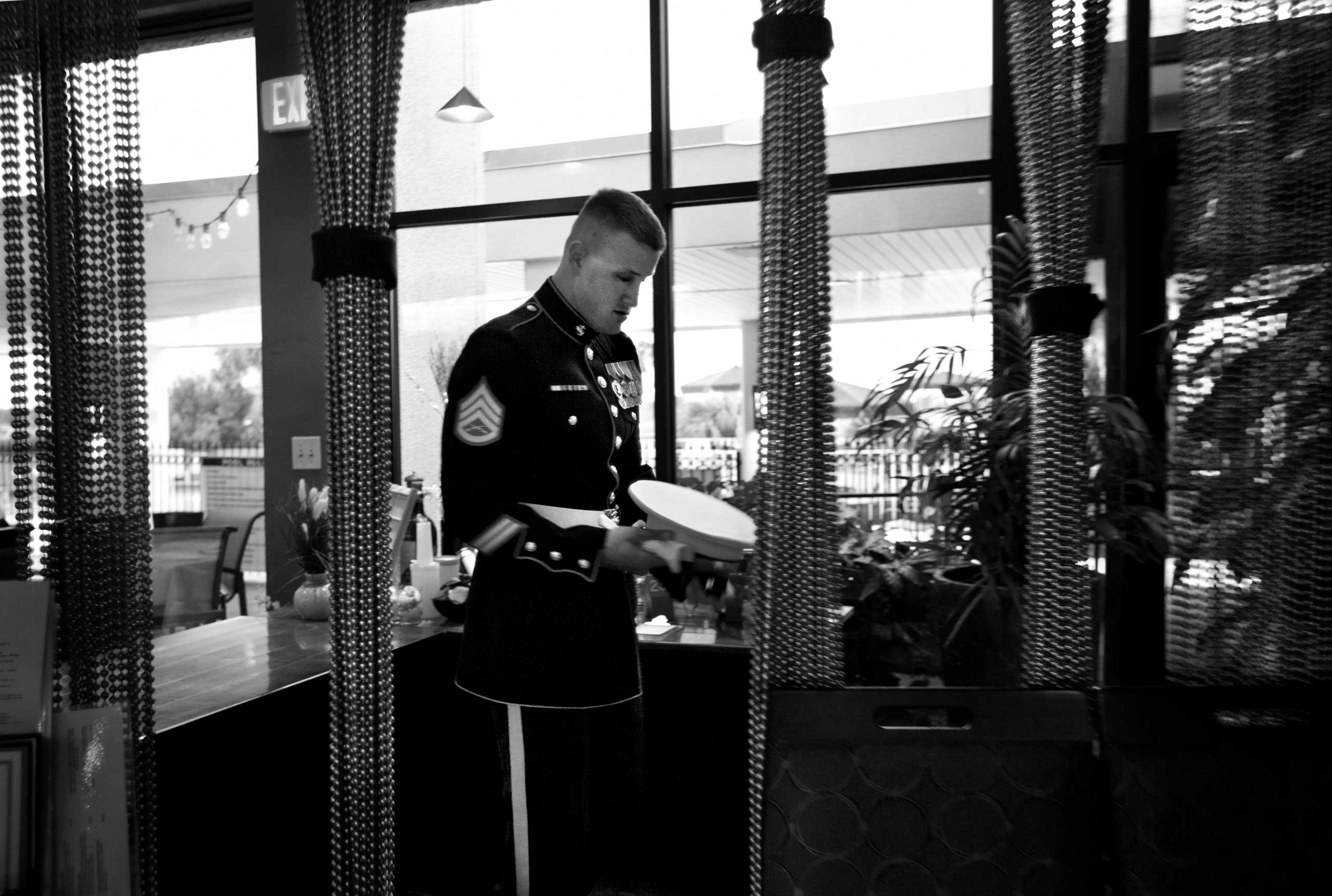 Staff Sergeant Jeremy Boutwell.
                              Stephanie Sinclair, Oct. 28, 2011. Camp Lejeune, N.C. 
                               Staff Sgt. Jeremy Boutwell, who served in the U.S. Marine Corps from 2003-2012, gets ready for the start of the 2011 U.S. Marine Corps Birthday Ball held especially for soldiers from the Wounded Warrior Battalion-East regiment. Boutwell was severely wounded with brain and eye injuries in an attack during a routine patrol in Iraq’s Anbar province in March 2004. With most of his family in the service, he was very reluctant to leave the USMC, even with his injuries. 'Being in the Marines is all I ever wanted to do, from the time I was 5 years old. I wish I could continue but my injuries continue to slow me down,' he said. 'I believe in what we do for our nation.'
                              I chose this photograph because I spent most of my time covering the civilians caught in the crossfire during my years of covering conflict in the Middle East. However, upon my return home to the U.S. after being based abroad, I learned that the wounds from the wars we engage in as a country run very deep, even for the soldiers involved. Some have more pronounced physical injuries other wounds are psychological. But I am amazed and humbled with the human spirit's ability to heal, no matter whose side of a conflict one is on. I was grateful that night to attend the ball. Marines who fought for us, and were gravely injured on our behalf, had a moment to be joyous with their loved ones. It was a night I will never forget.