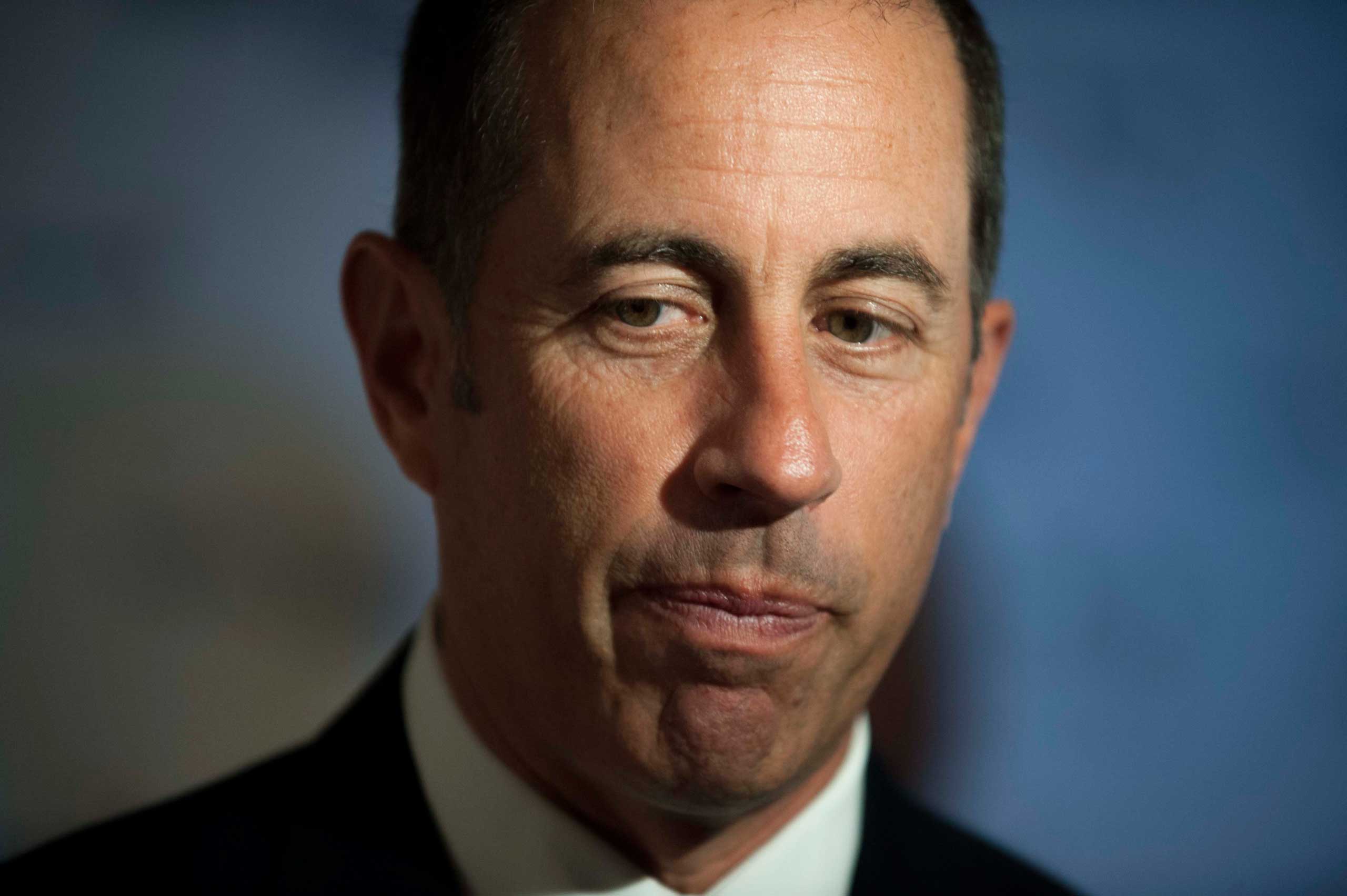 Jerry Seinfeld pauses as he is interviewed on the red carpet at the Kennedy Center for the Performing Arts for the Mark Twain Prize for American Humor, Oct. 19, 2014, in Washington. (Kevin Wolf—AP)