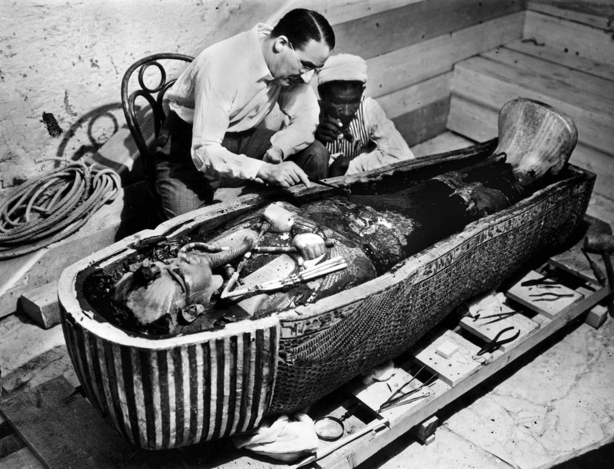 Howard Carter, English Egyptologist, near golden sarcophagus of Tutankhamon in Egypt in 1922 (Rue des Archive / Getty Images)