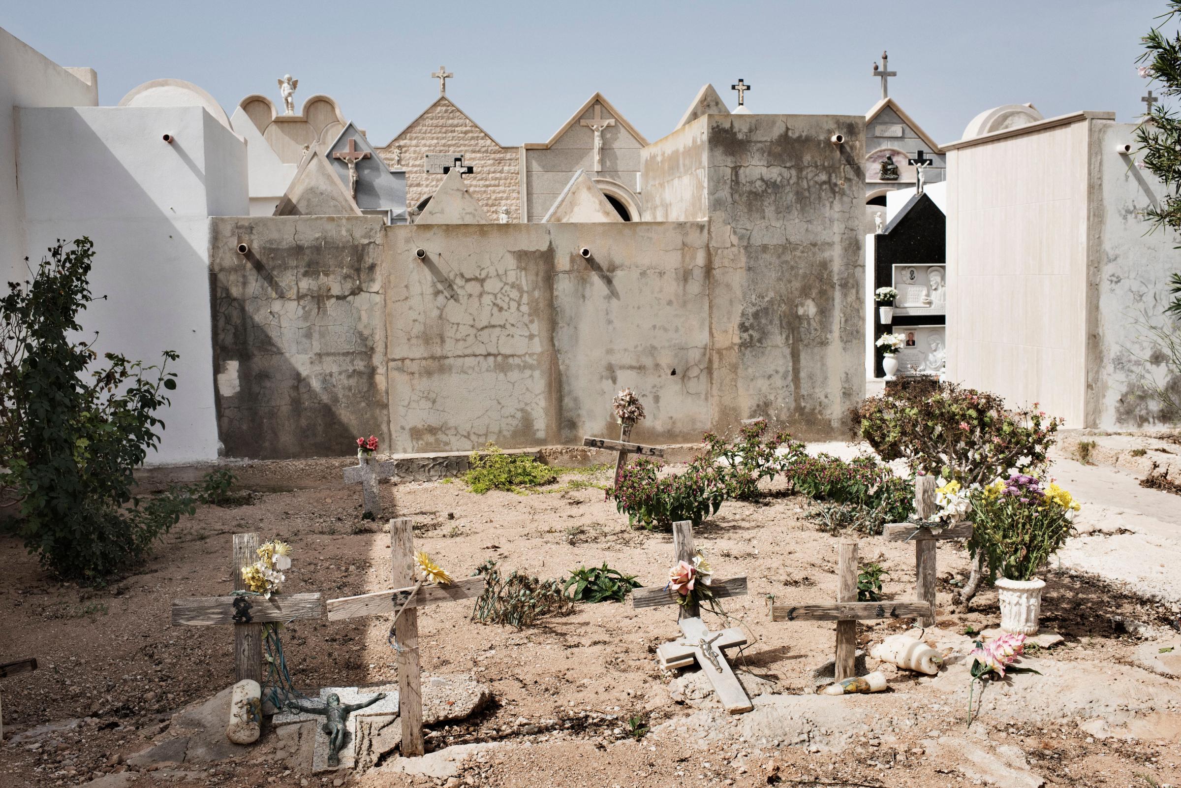 The nameless graves in the cemetery belong to unidentified migrants found dead on the beach of Lampedusa in Italy.