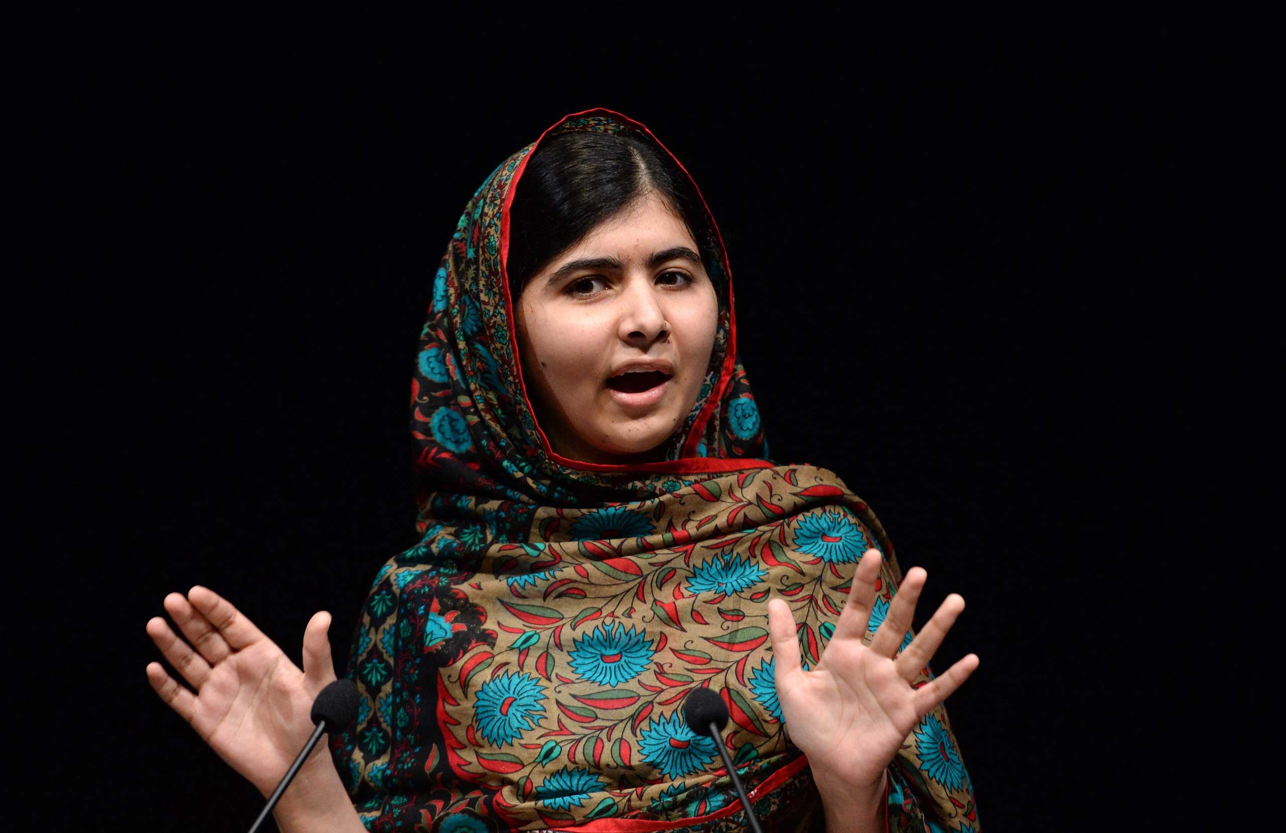 Malala Yousafzai of Pakistan delivers a statement after winning the Nobel Peace Prize in the Library of Birmingham in Birmingham, England on Oct. 10, 2014. (Facundo Arrizabalaga—EPA)