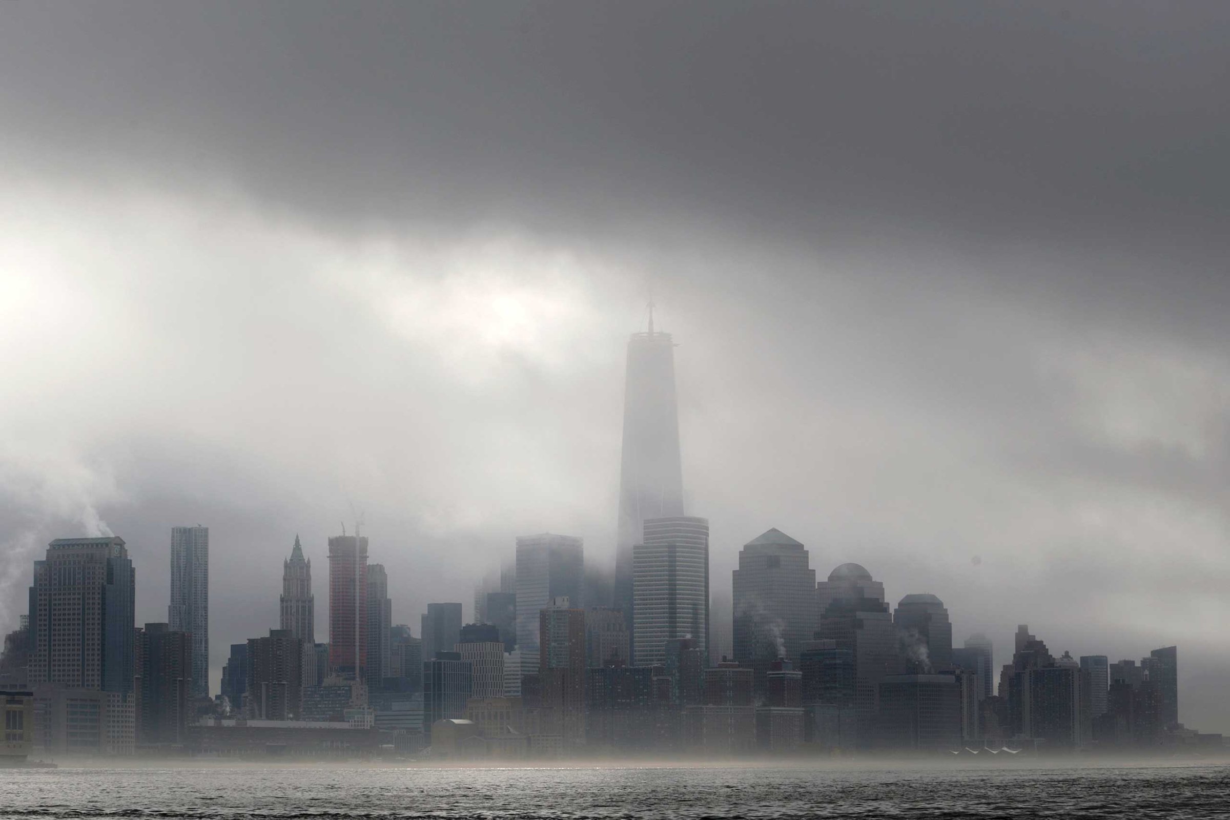 Heavy fog blankets lower Manhattan in New York, including One World Trade Center, center, in this view across the Hudson River from Hoboken, N.J., Nov. 12, 2014.
