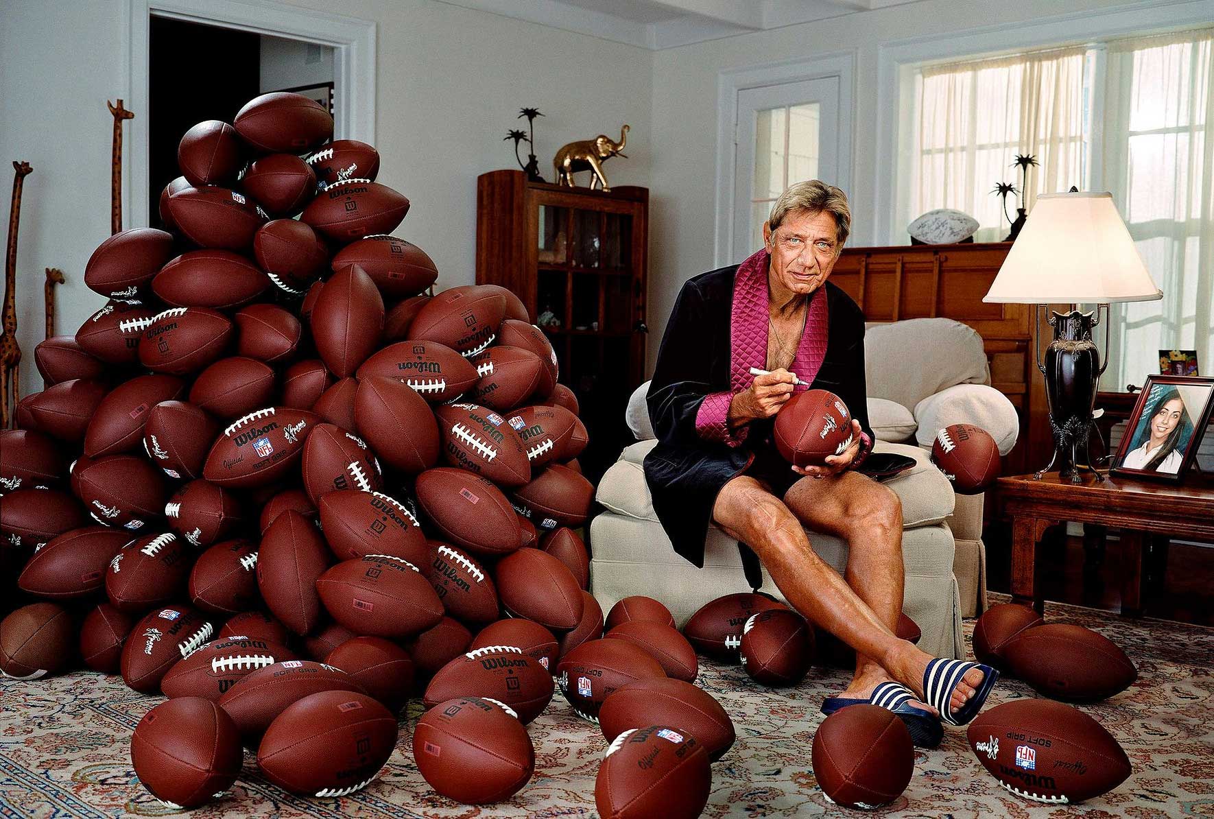 Joe Namath."Again [being from Germany], I had never heard of him before. What retired athletes do, the famous ones, is they often sign baseballs and footballs. I thought: 'How funny would put be if he was beside a pile of footballs signing them?' We set up the balls. It's one frame. There is no retouching on them.It was for GQ so normally he would be looking sharp in a suit [but] it was in Florida and I brought that robe. He is a funny, outgoing guy, so I thought it would suit him perfectly."
