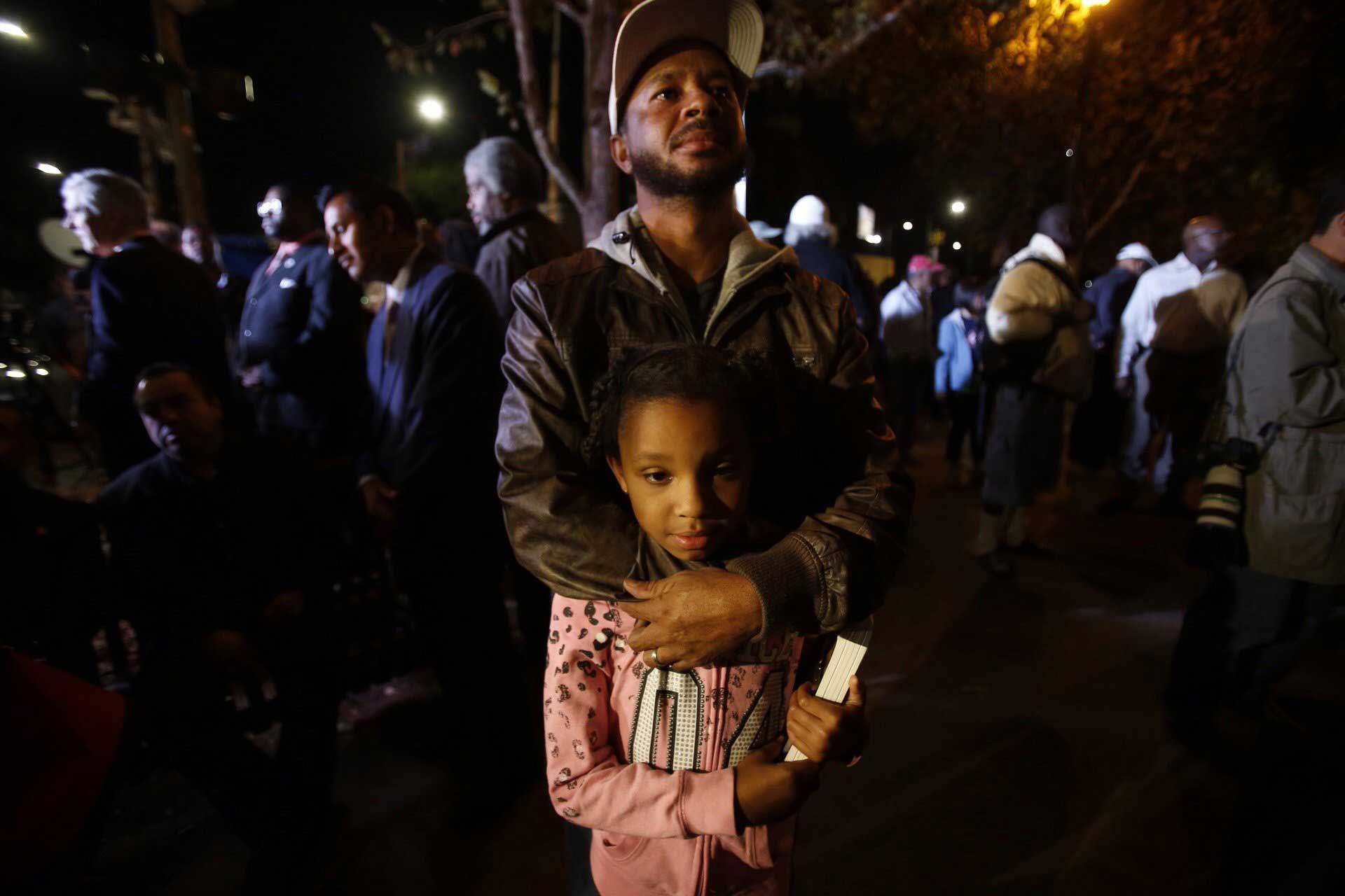 Donald Fields, 37, with daughter Olivia Fields, 9, at a Leimert Park gathering in Los Angeles on Nov. 24, 2014.