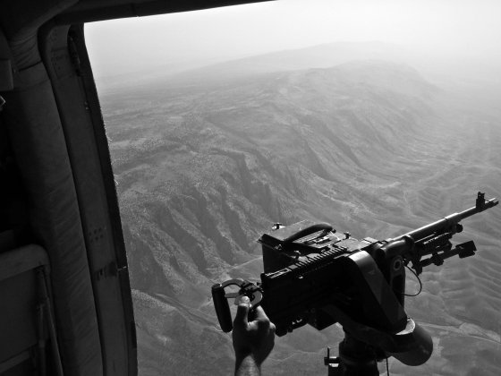 The view from an Iraqi air force helicopter on a rescue mission to drop food and aid to thousands of displaced Yezidis taking refuge in the Sinjar Mountains. Iraq. Aug. 12, 2014.