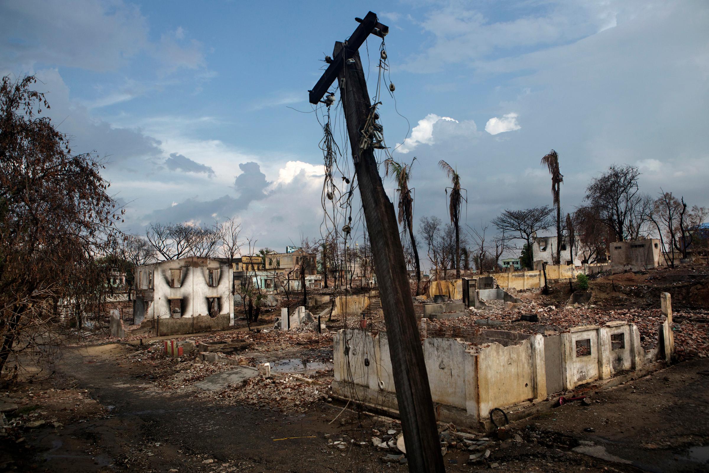 Evidence of ethnic strife as seen by burned trees and destroyed buildings in the Muslim quarter in Meikhtila, Burma, May 23, 2013.