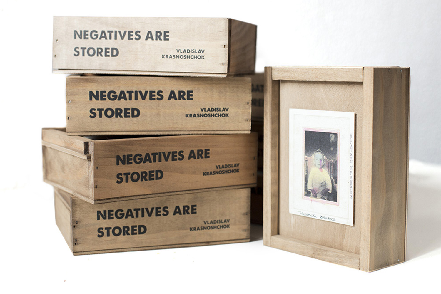 For Vladyslav Krasnoshchok's book <em>Negatives Are Stored</em>, the self-publishing company Riot Books created wooden boxes to store the images. (Riot Books)