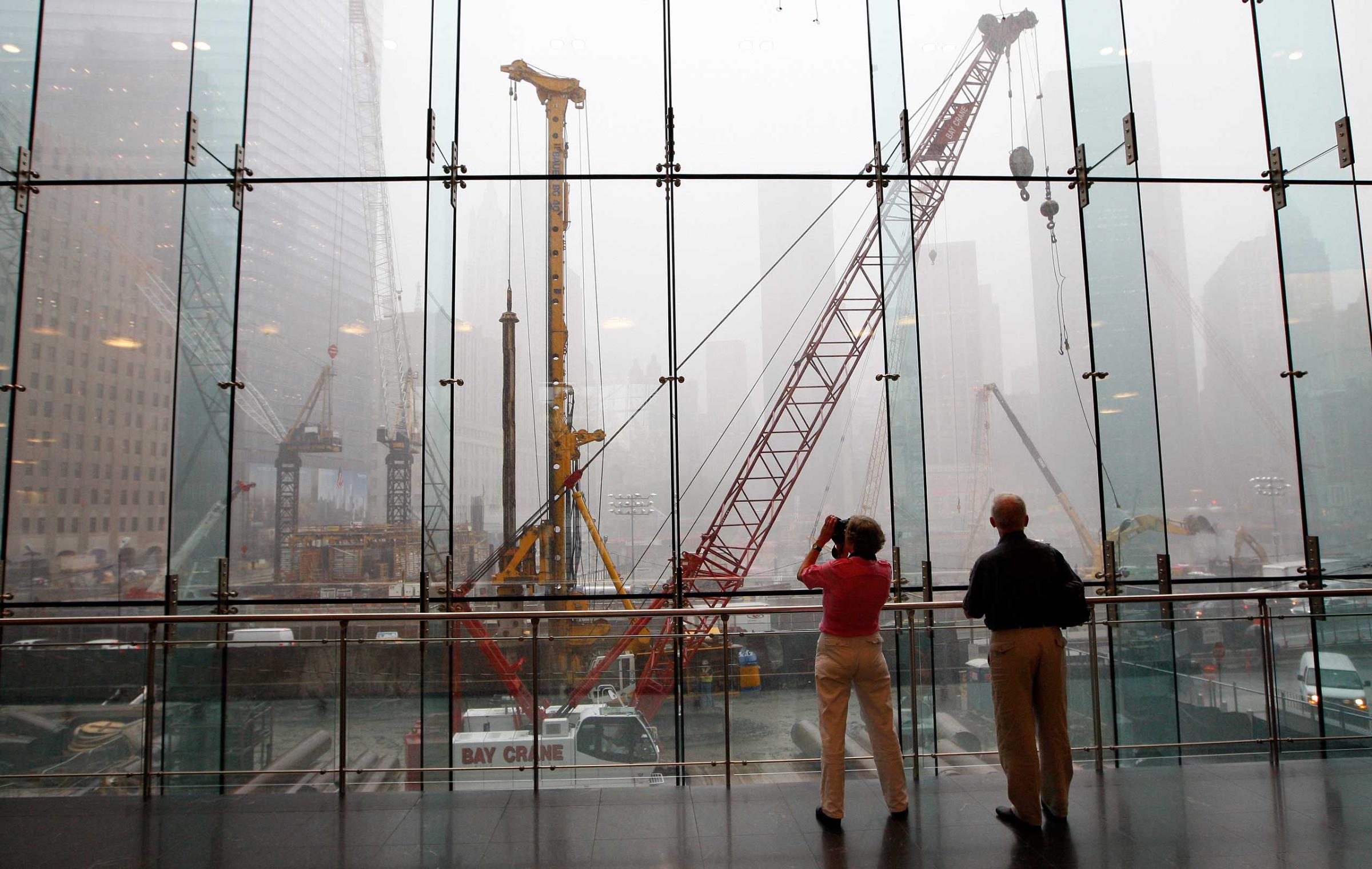 Tourists look out over the World Trade Center site, two days before the seventh anniversary of the attacks of Sept. 11, 2001 in New York on Sept. 9, 2008.